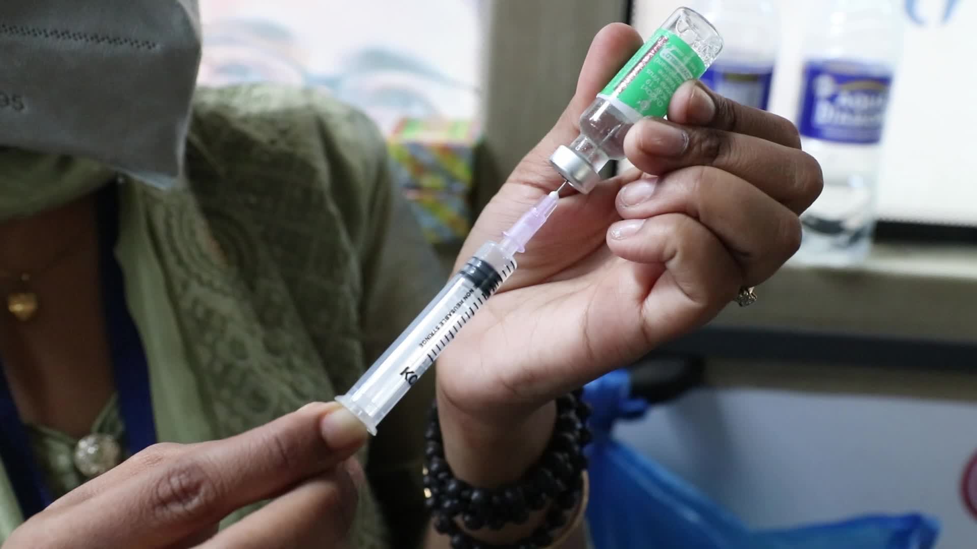 Coronavirus vaccination in a bus in India
