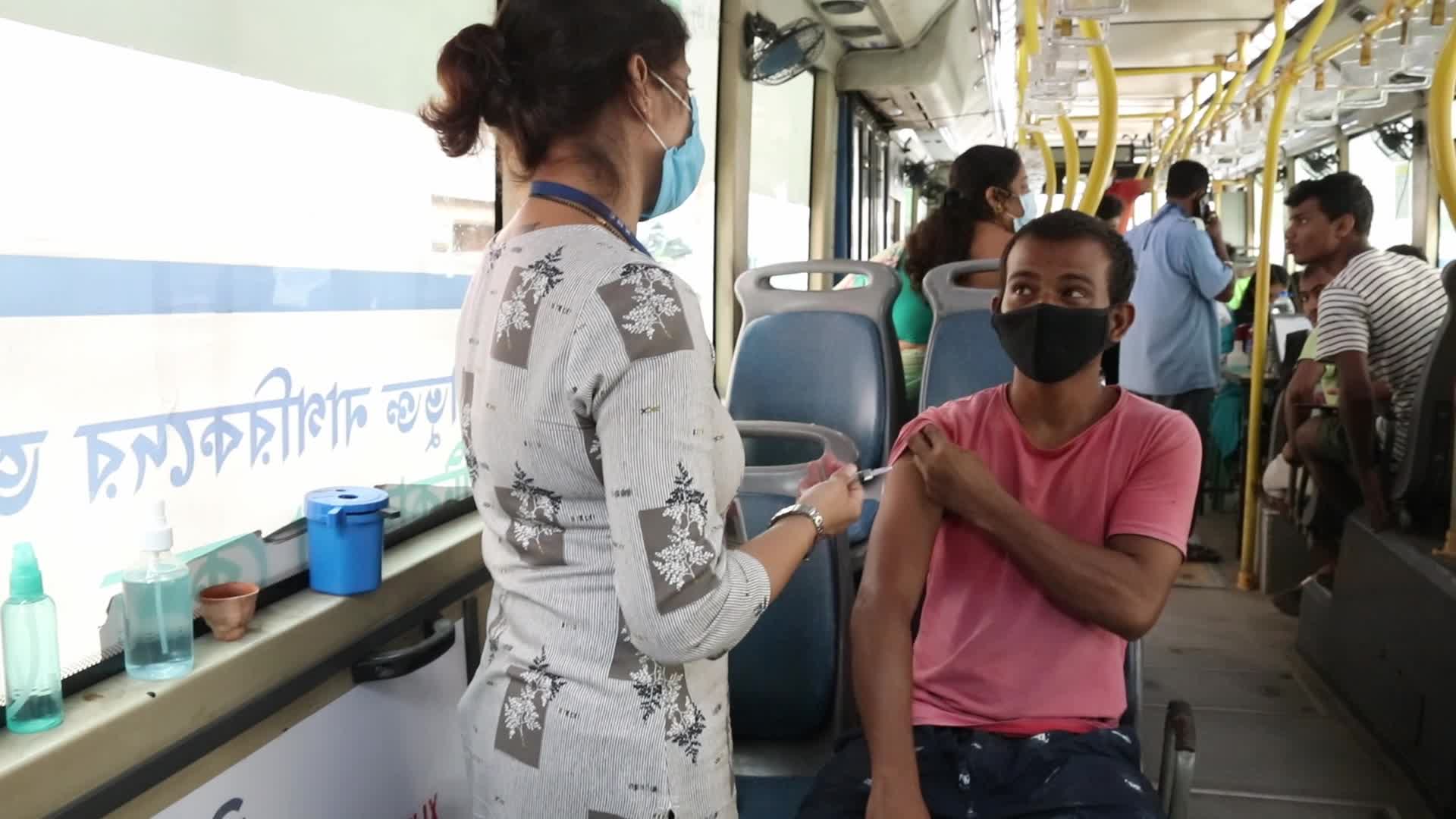 Coronavirus vaccination in a bus in India