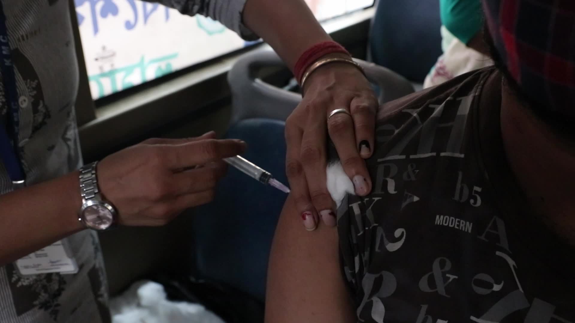 Coronavirus vaccination in a bus in India