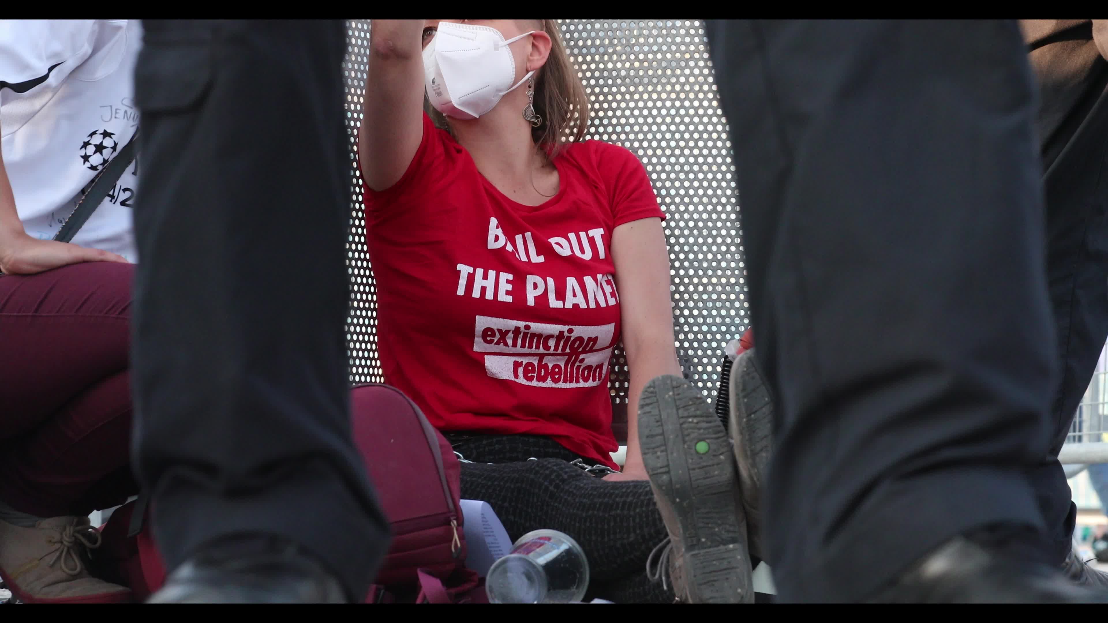 Extinction Rebellion activists protest in front of the Allianz Arena
