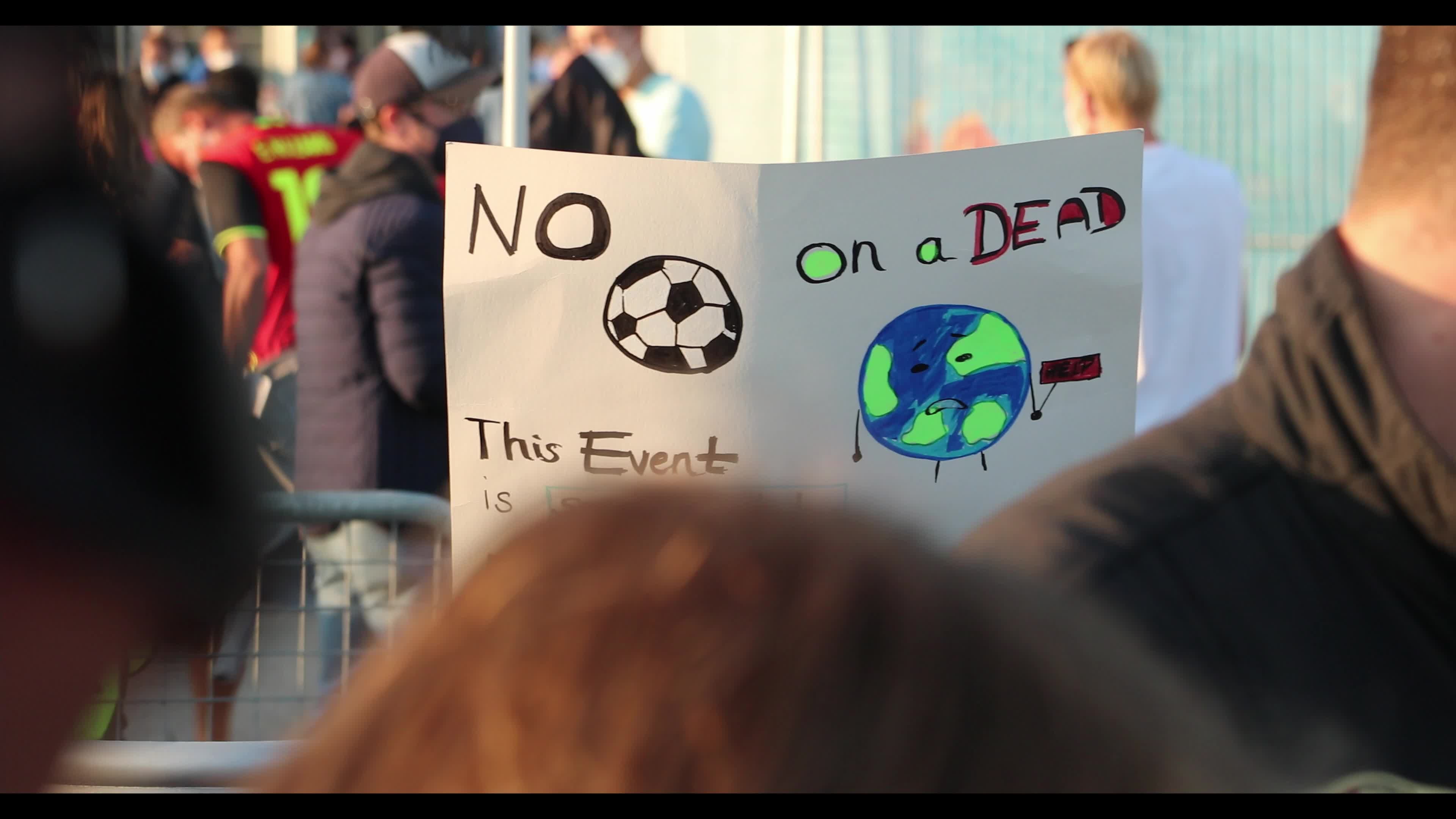 Extinction Rebellion activists protest in front of the Allianz Arena