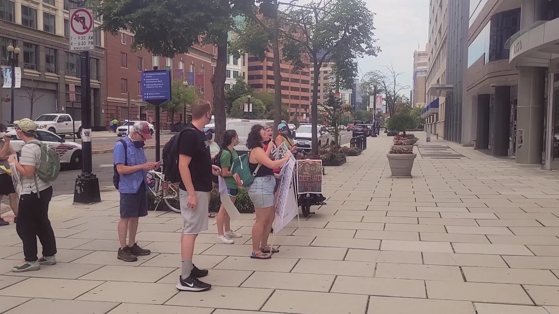 Climate activists demonstrate outside of banks in Washington, D.C.