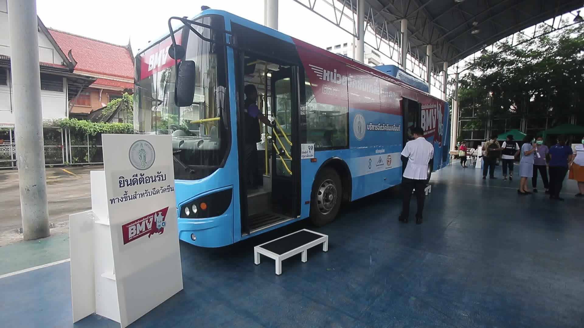 People get a dose of AstraZeneca vaccine on a BKK Mobile Vaccination Unit (BMV) vehicle in Bangkok