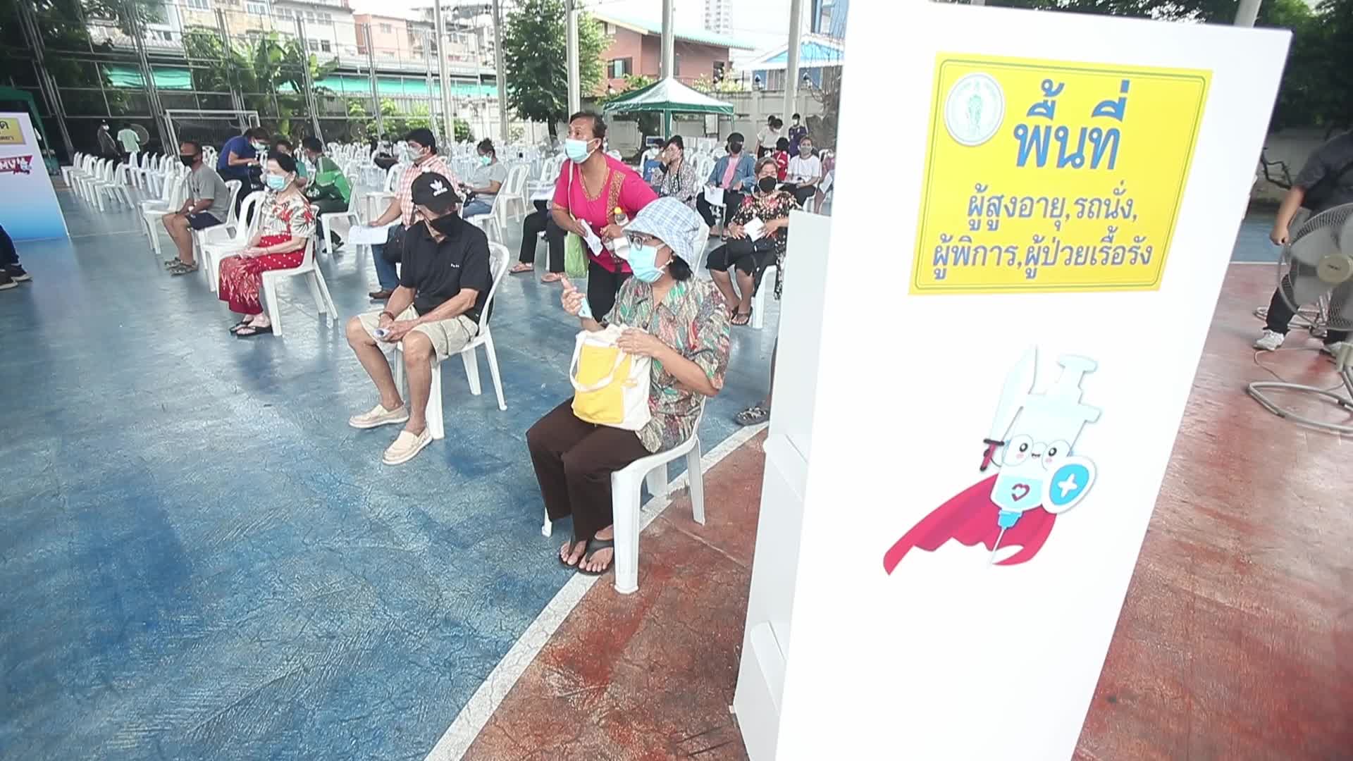 People get a dose of AstraZeneca vaccine on a BKK Mobile Vaccination Unit (BMV) vehicle in Bangkok