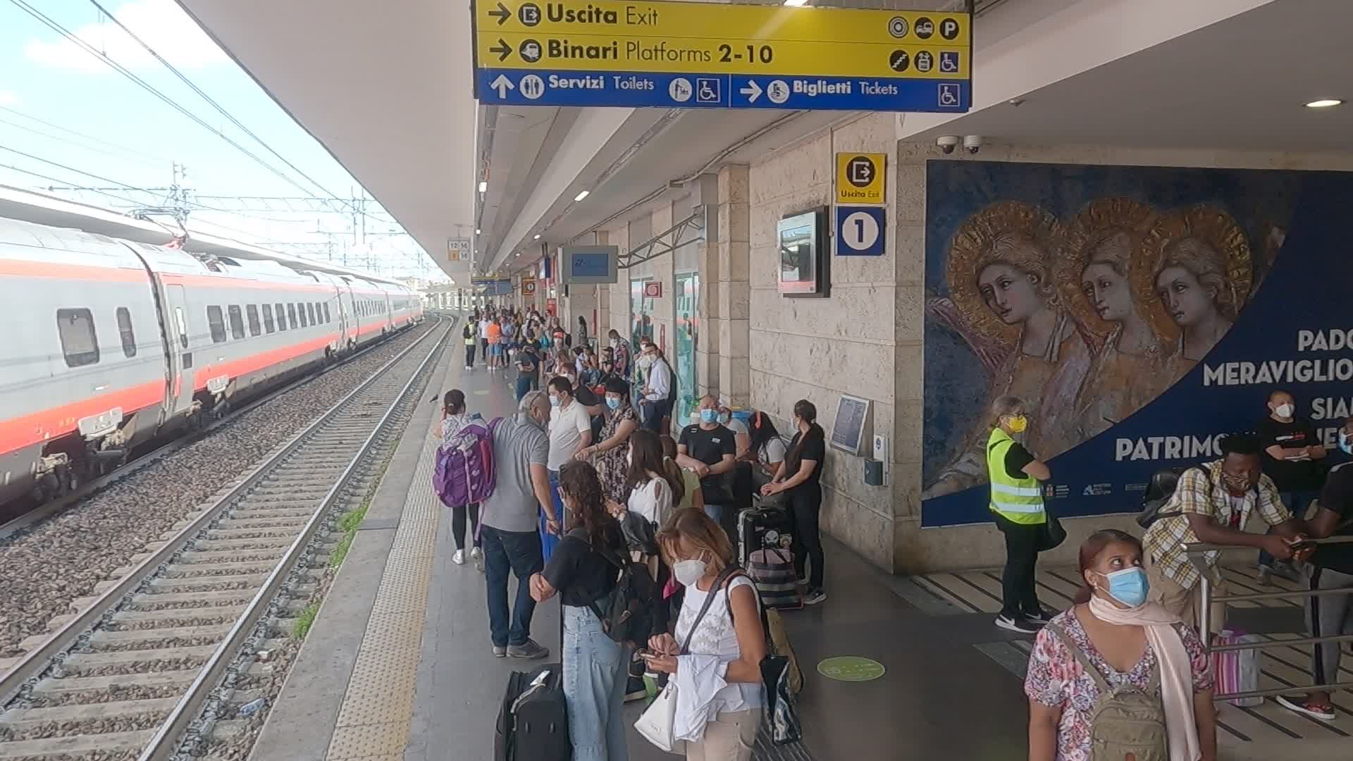 Passengers waiting for the train to Venice in Padua 