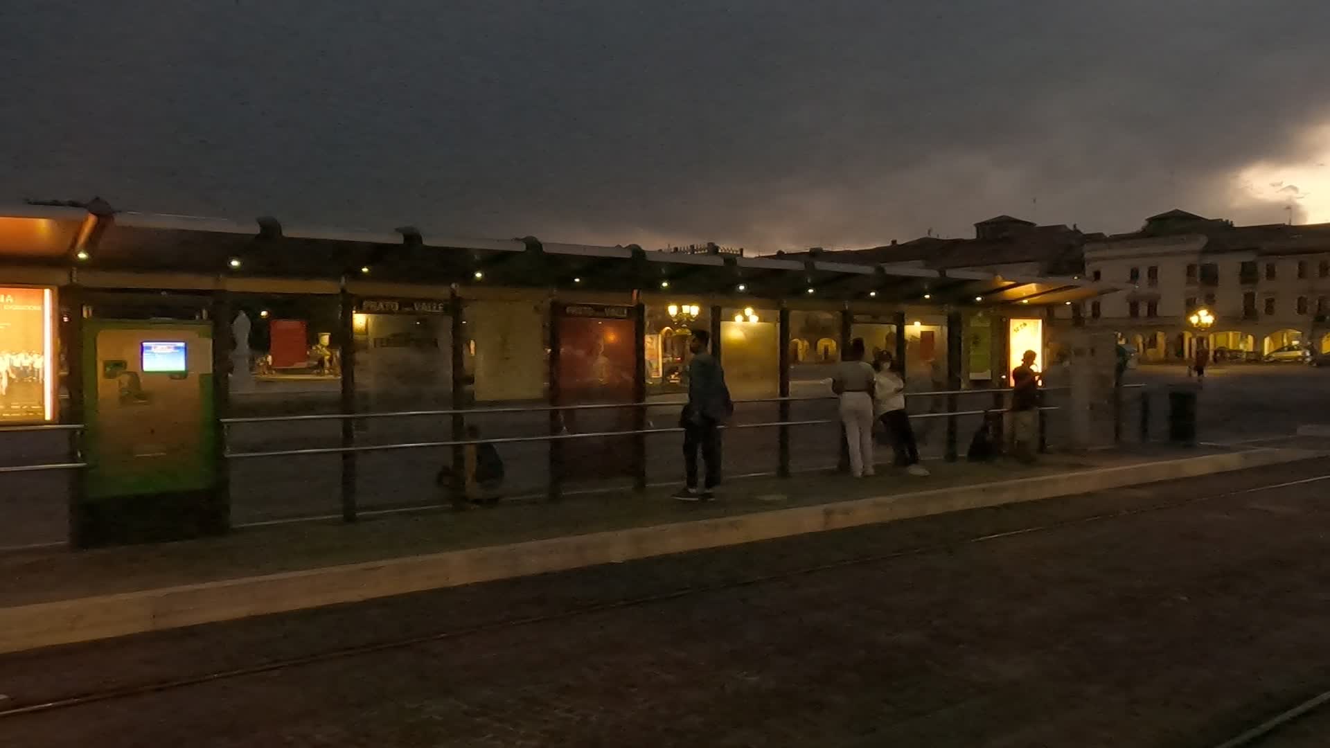 Passengers waiting for the tram in Prato della Valle in Padua