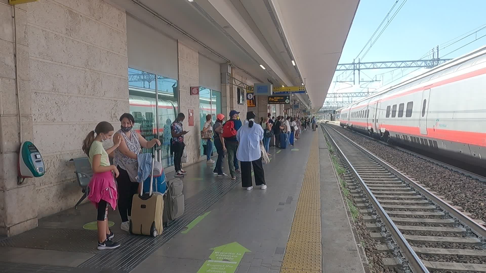 Passengers waiting at platform 1 of the Padua train station 