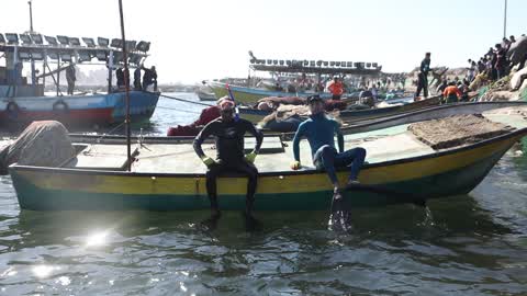 Volunteers in Gaza clean up the port