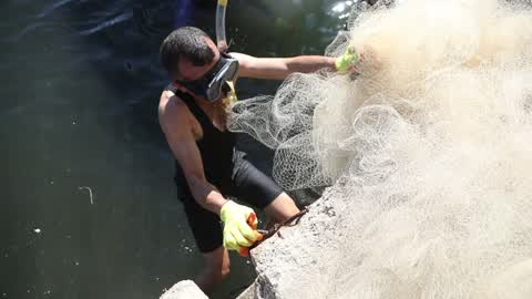 Volunteers in Gaza clean up the port