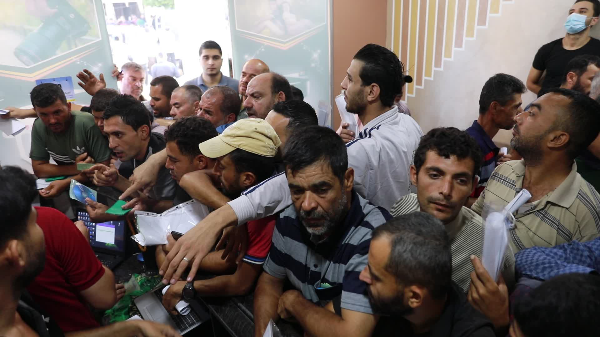 Tens of thousands in Gaza line up for Israeli work permits