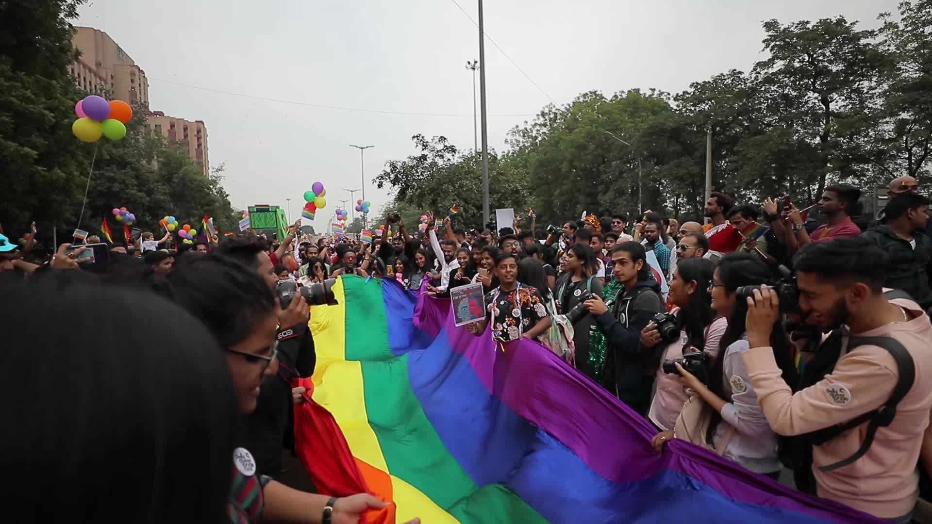 People waves Rainbow/LGBT pride flag in Pride Parade in Delhi, India
