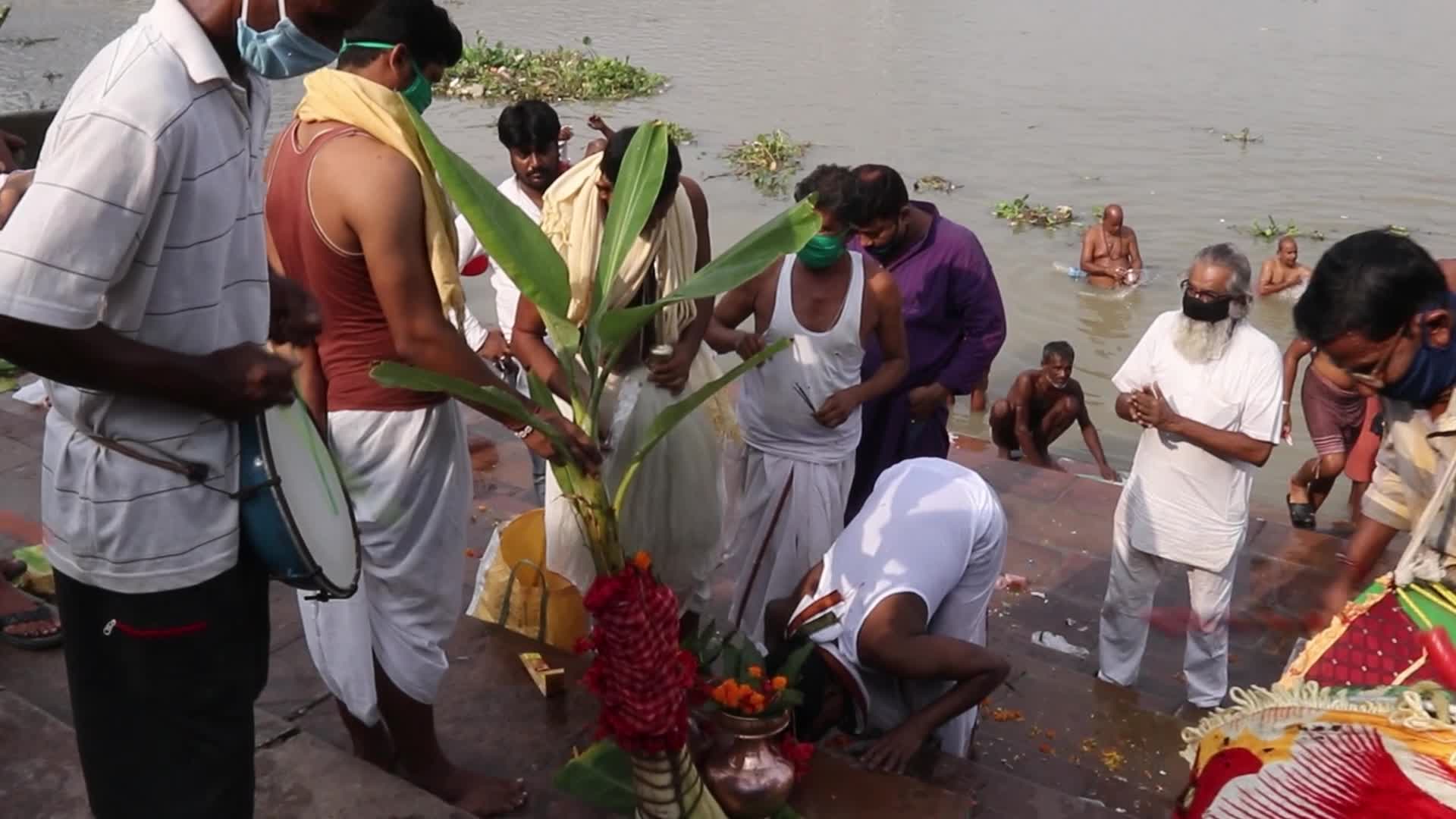 Indian Hindu devotees perform rituals during the Durga Puja