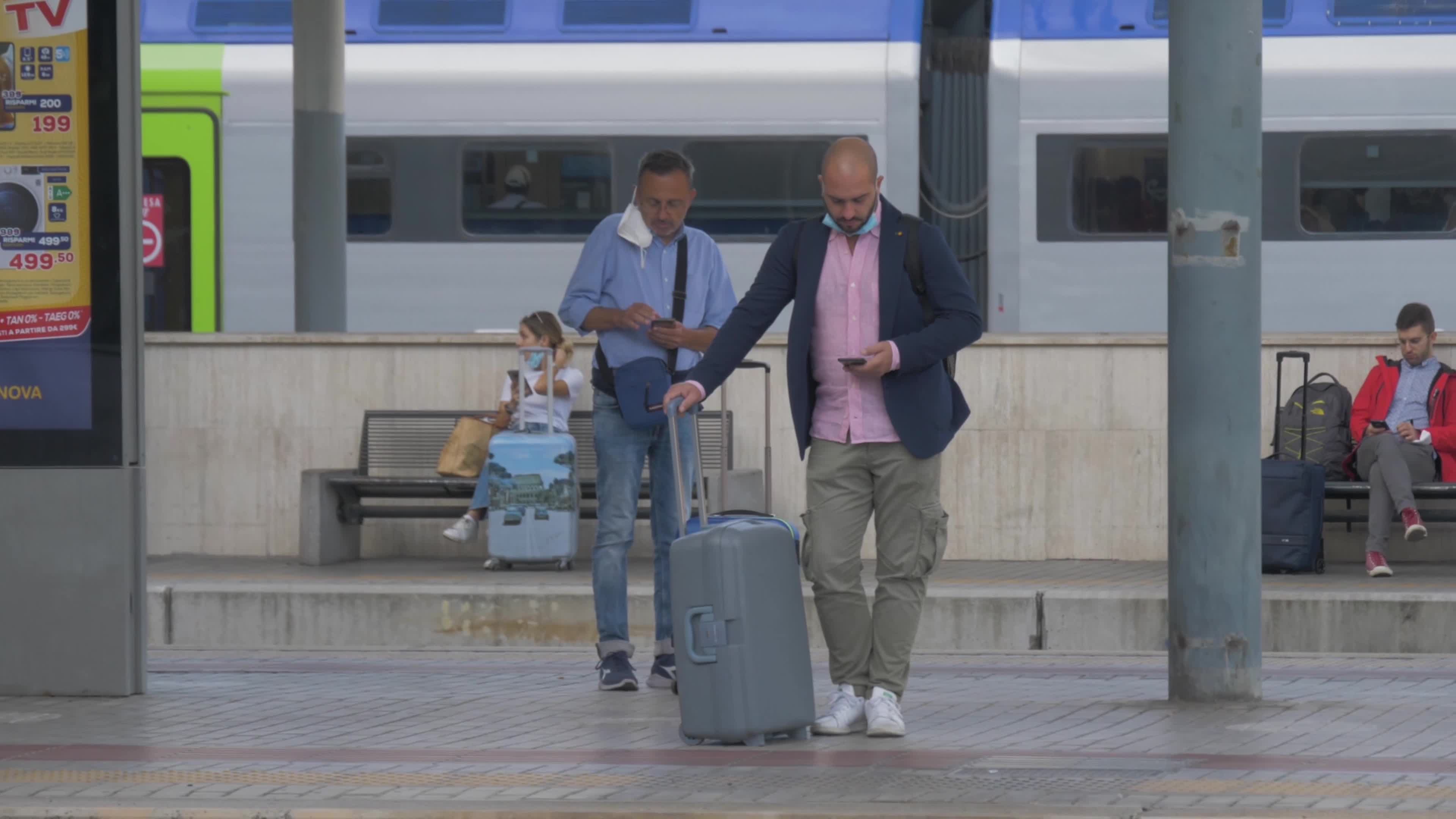 Tourists and workers who take a long-distance train (Green Pass Mandatory) at Tiburtina Station in Rome