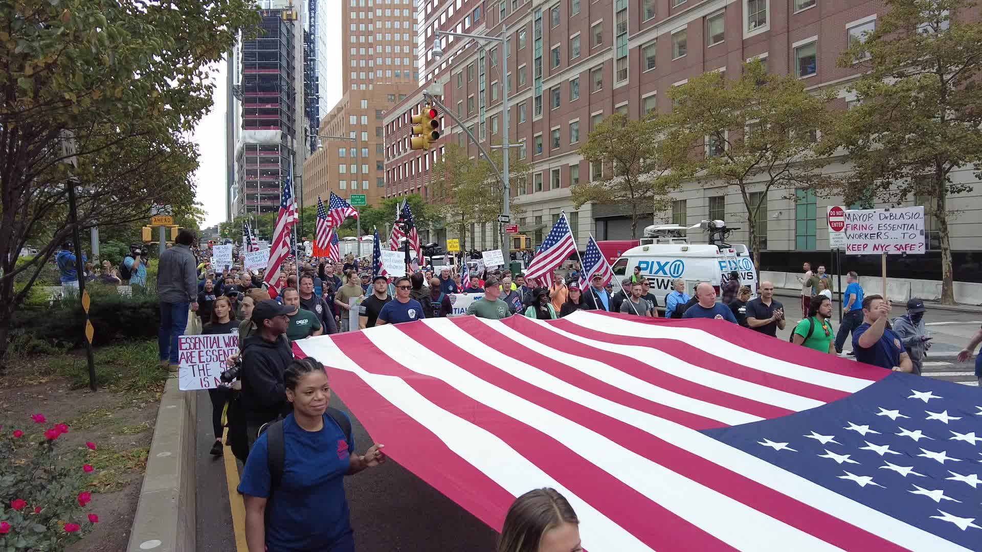 Anti Covid-19 protesters MarchAcross The Brooklyn Bridge in New York City