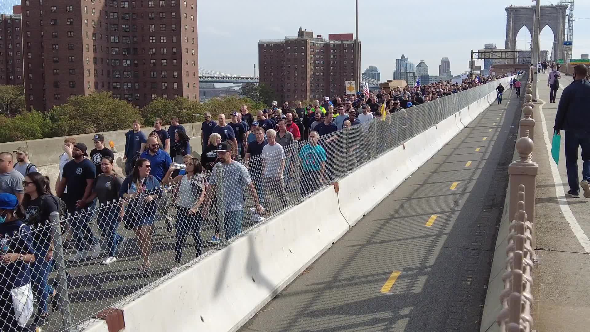 Anti Covid-19 protesters MarchAcross The Brooklyn Bridge in New York City