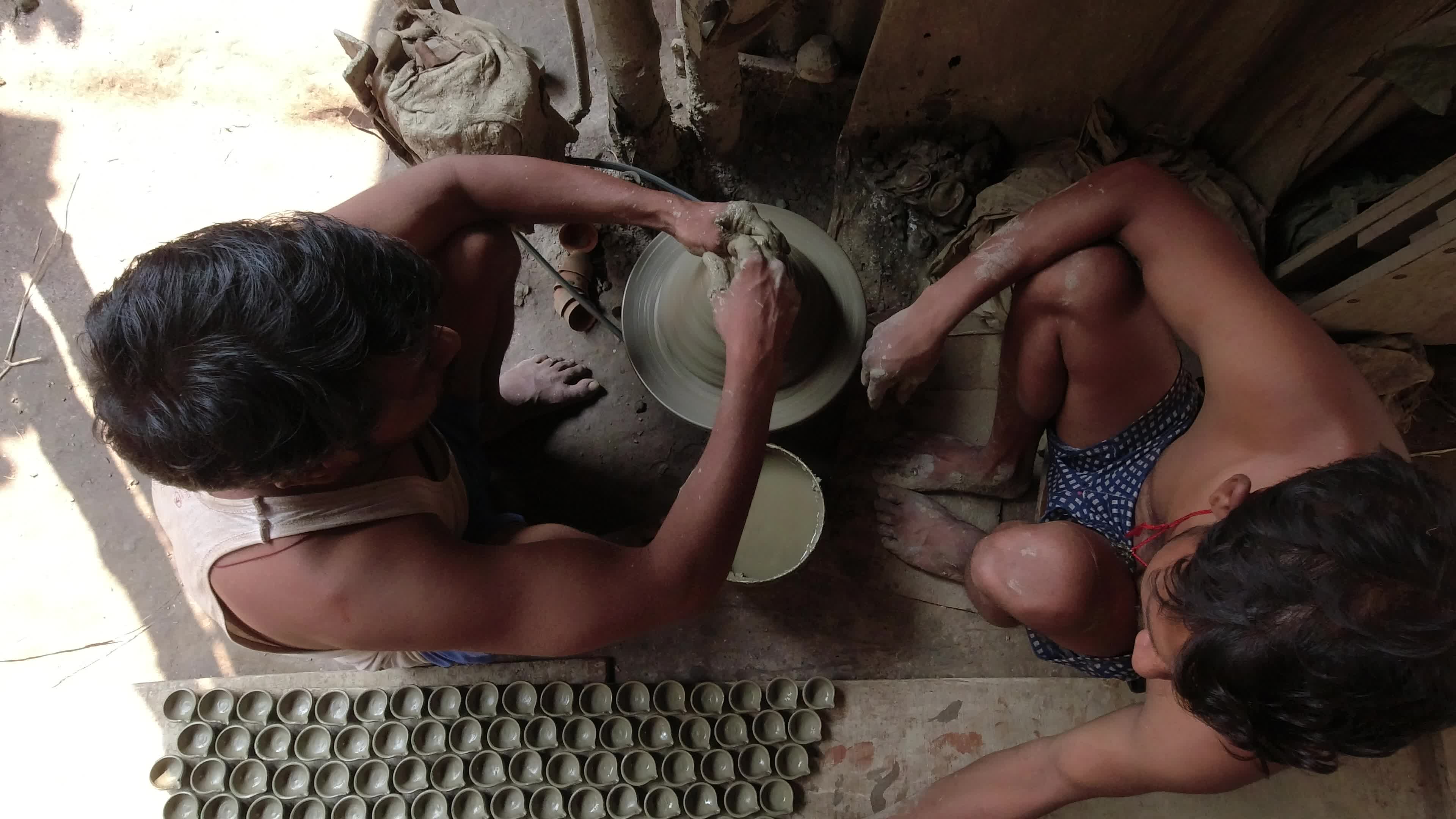 Oil lamp making for Diwali festival in Kolkata