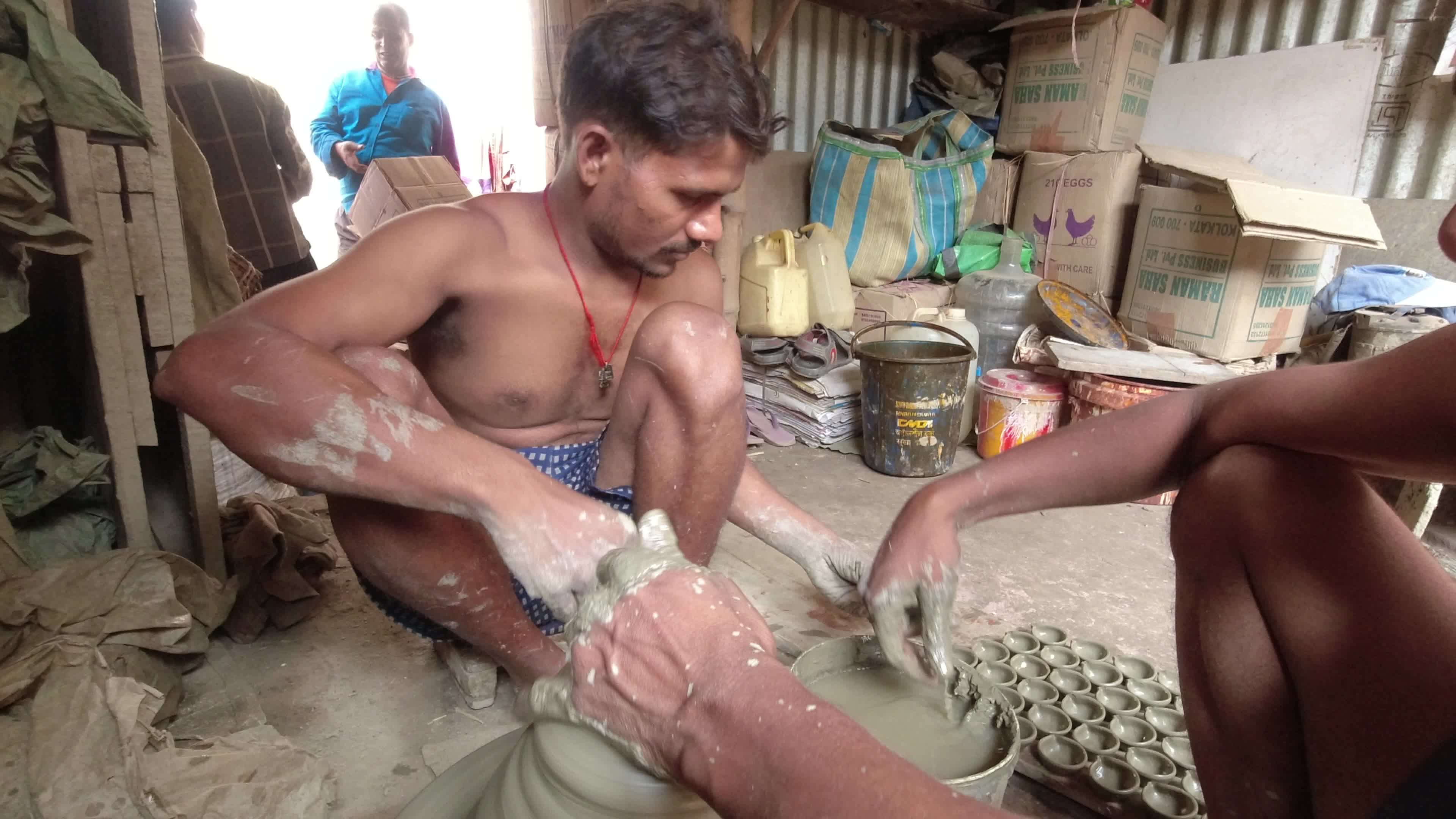 Oil lamp making for Diwali festival in Kolkata