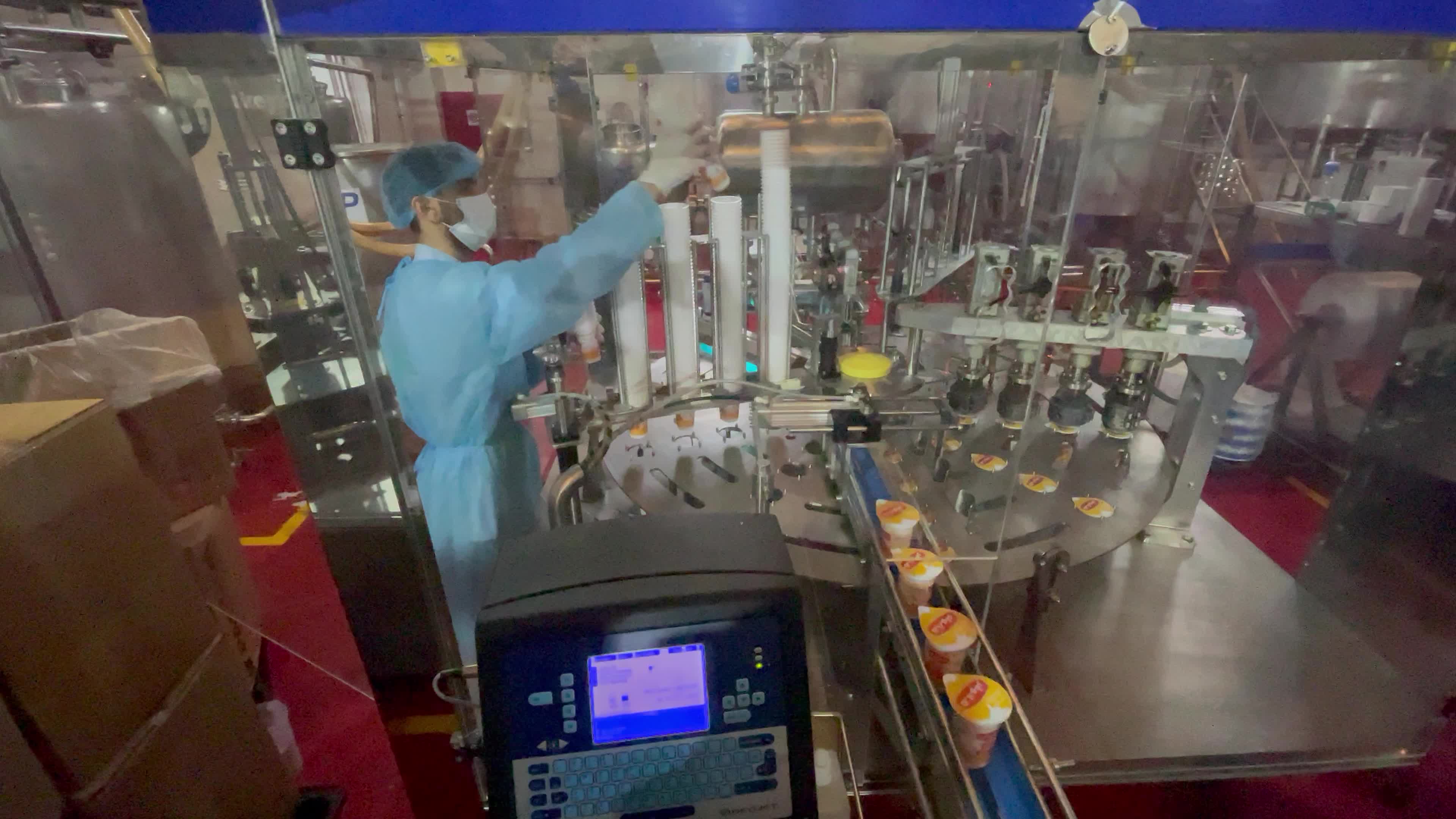 Palestinian employees work at Hanover factory for dairy