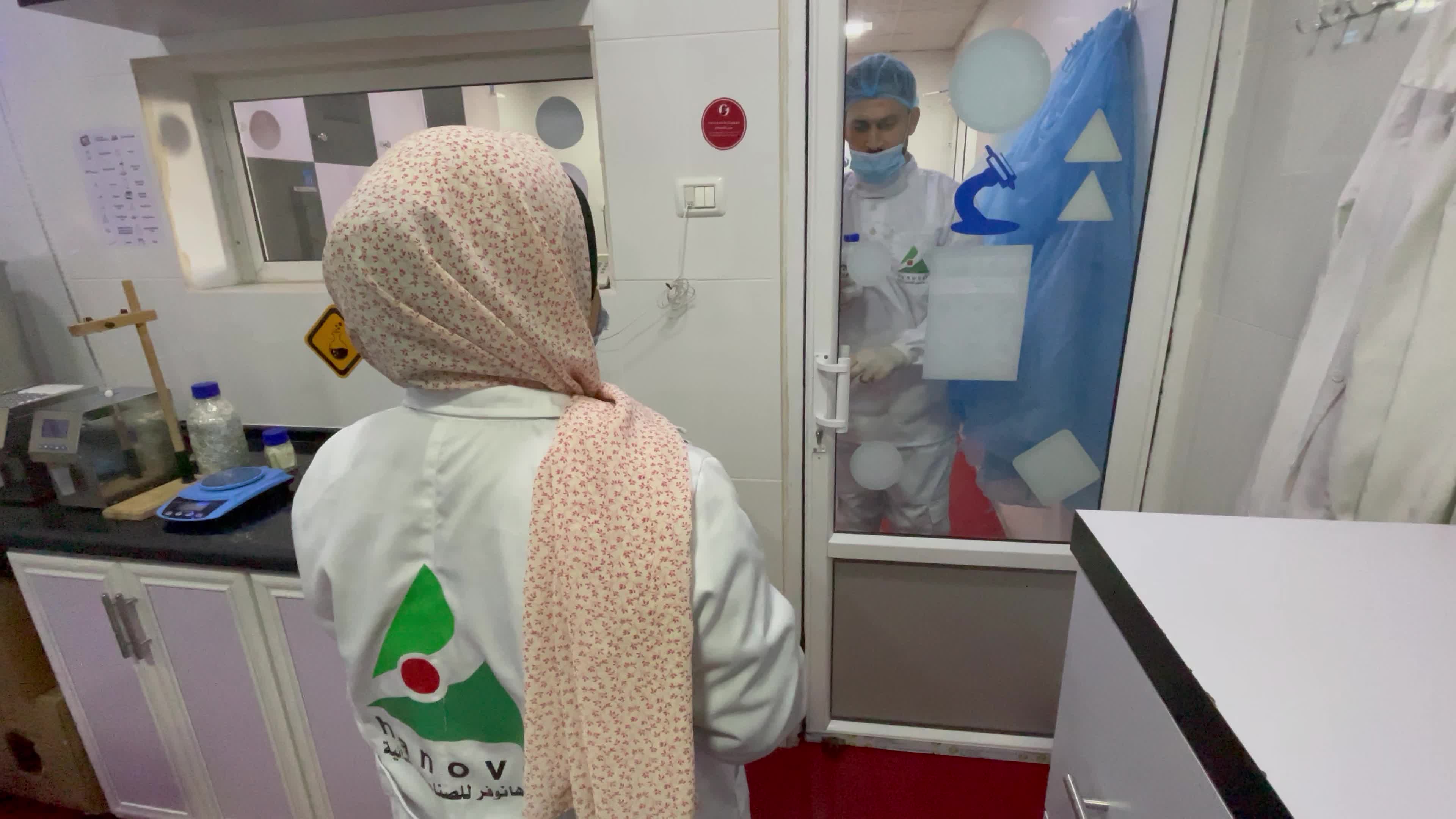 Palestinian employees work at Hanover factory for dairy