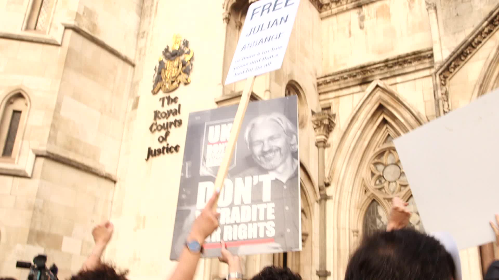 Supporters of Wikileaks founder Julian Assange protest in London