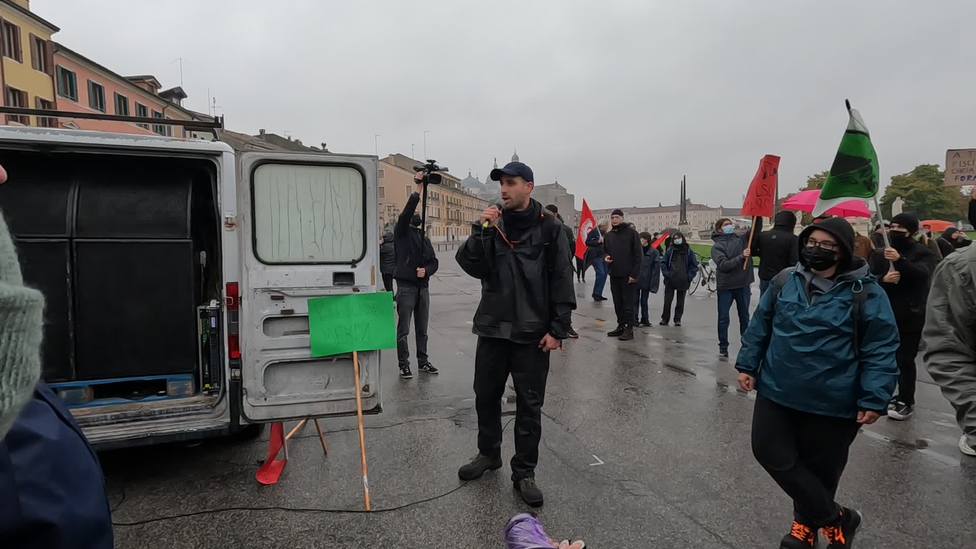 A protester lists Jair Bolsonaro's crimes