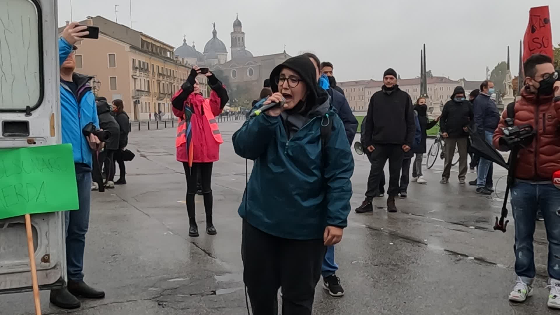A protester lists Jair Bolsonaro's crimes