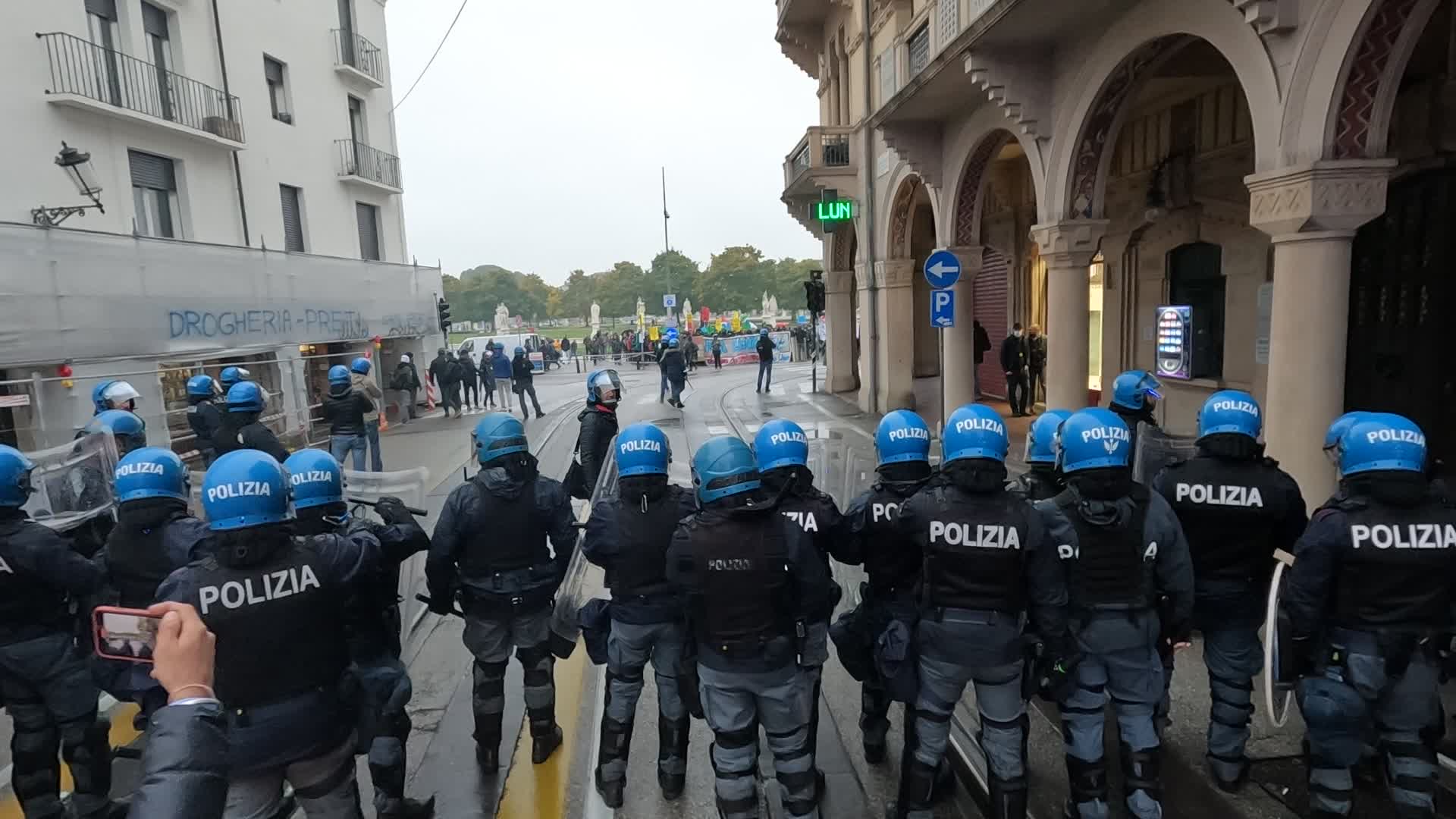 Police in riot gear are preparing to charge the demonstrators