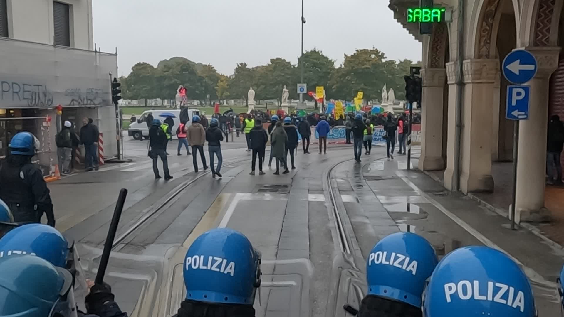 Police in riot gear are preparing to charge the demonstrators