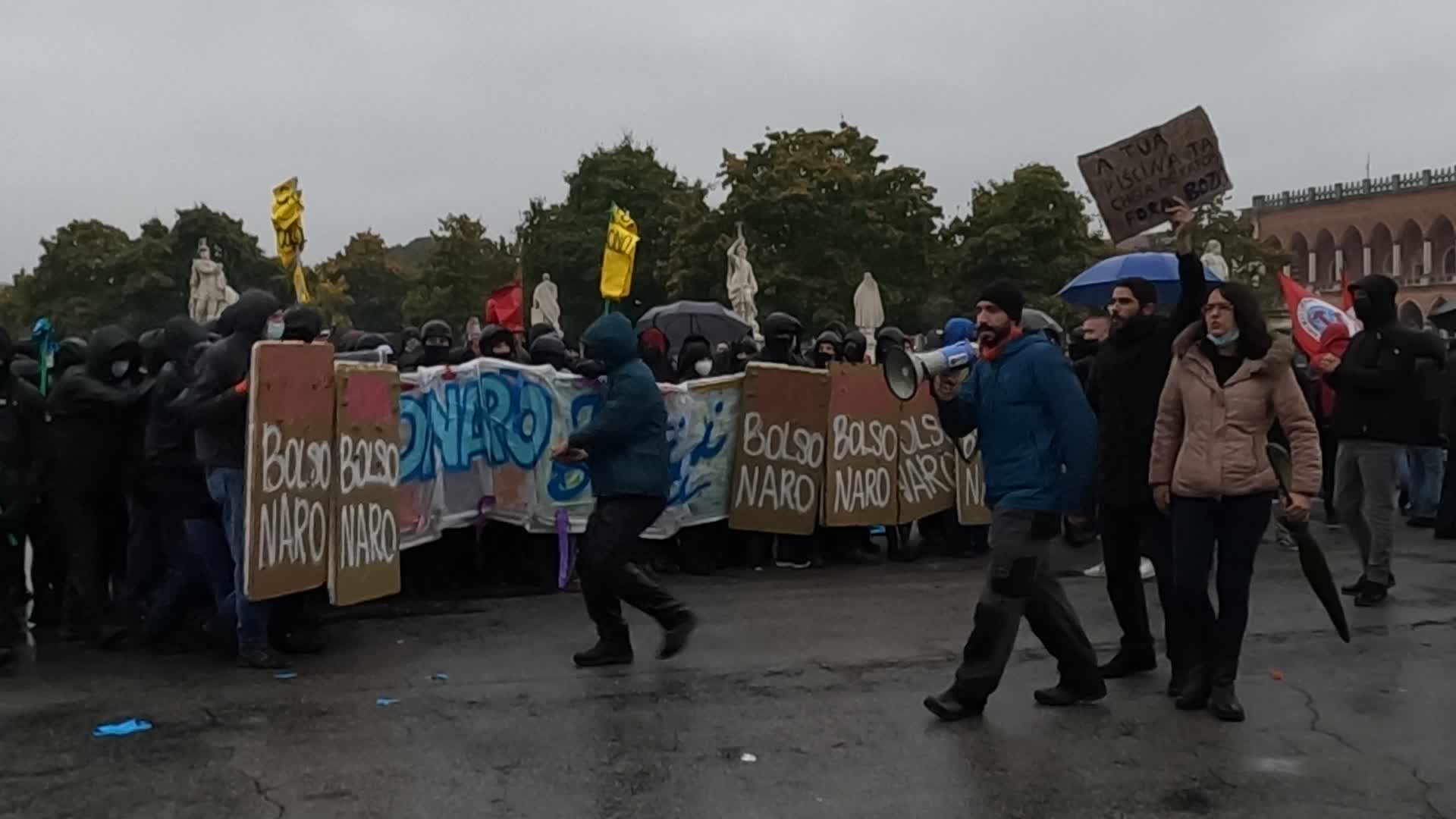A protester screams the crimes of Jair Bolsonaro