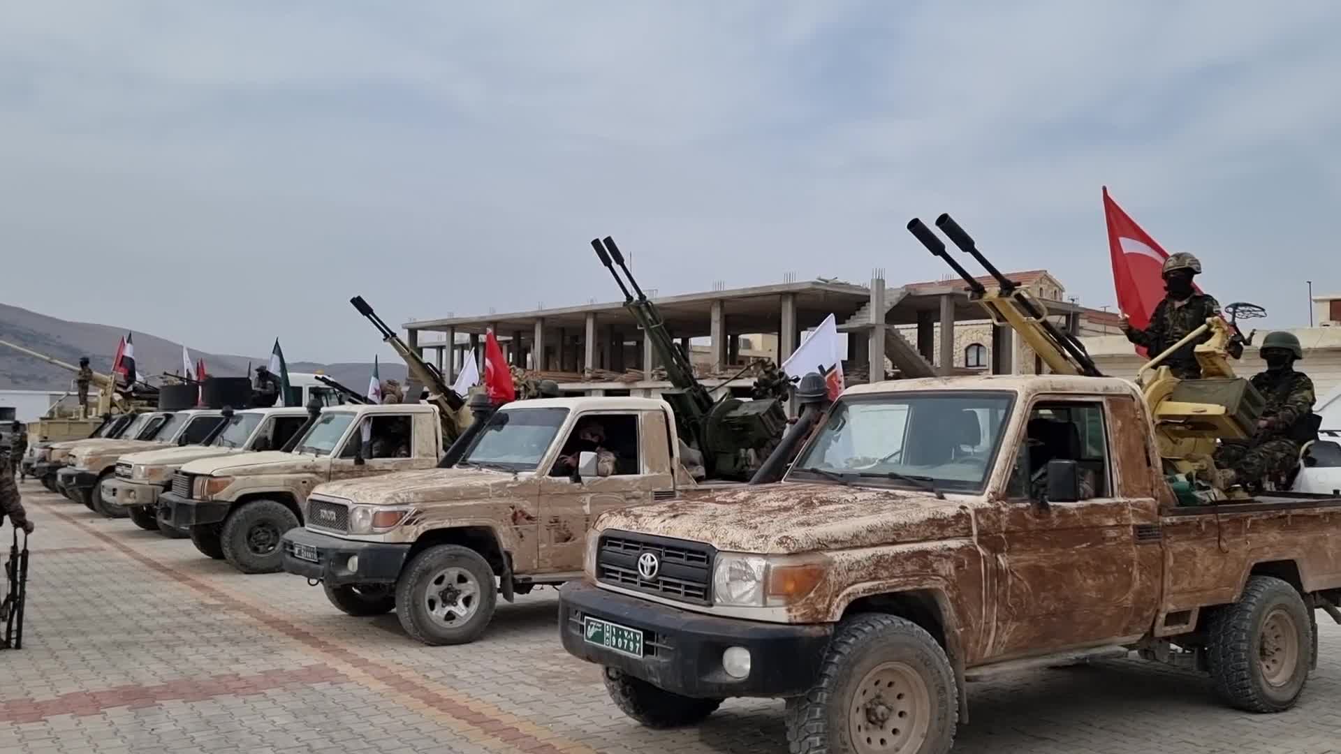 Turkish-backed Syrian rebel fighters take part in a military exercise