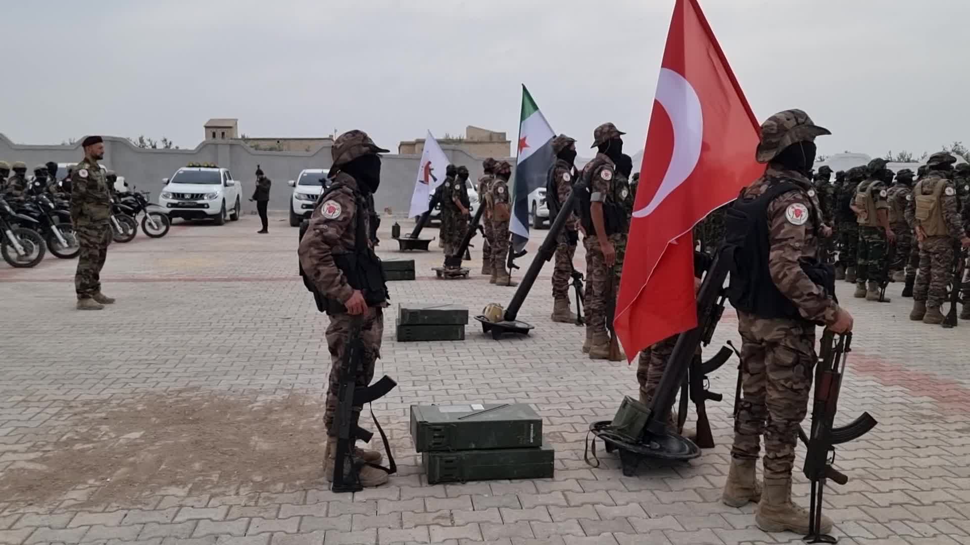 Turkish-backed Syrian rebel fighters take part in a military exercise