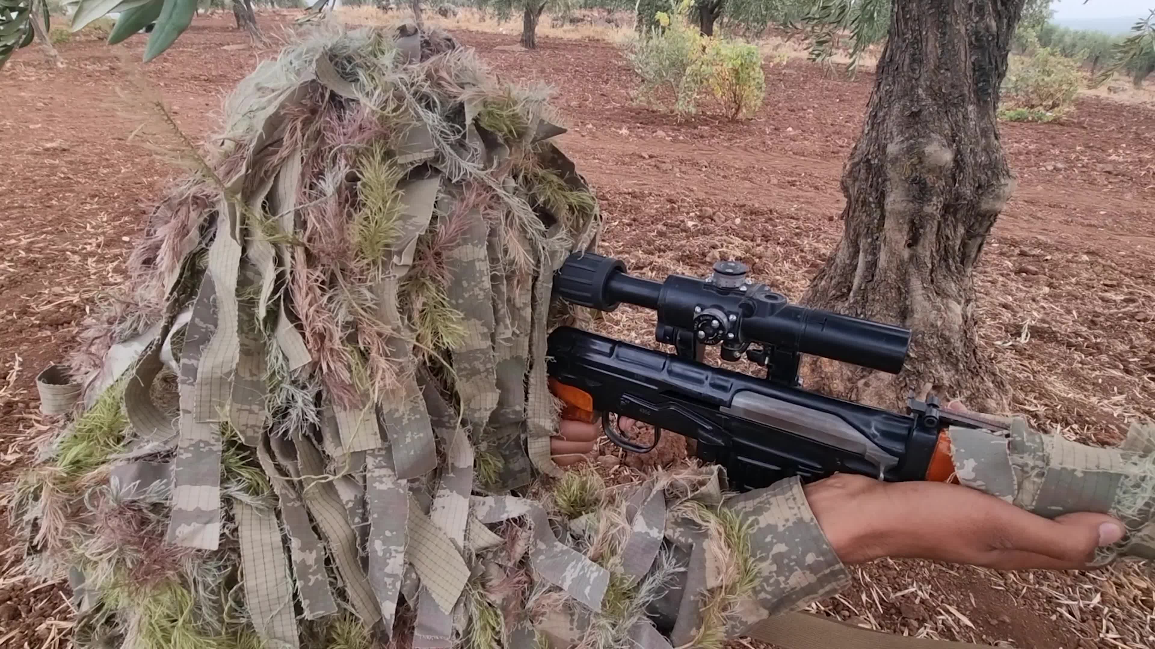 Turkish-backed Syrian rebel fighters take part in a military exercise