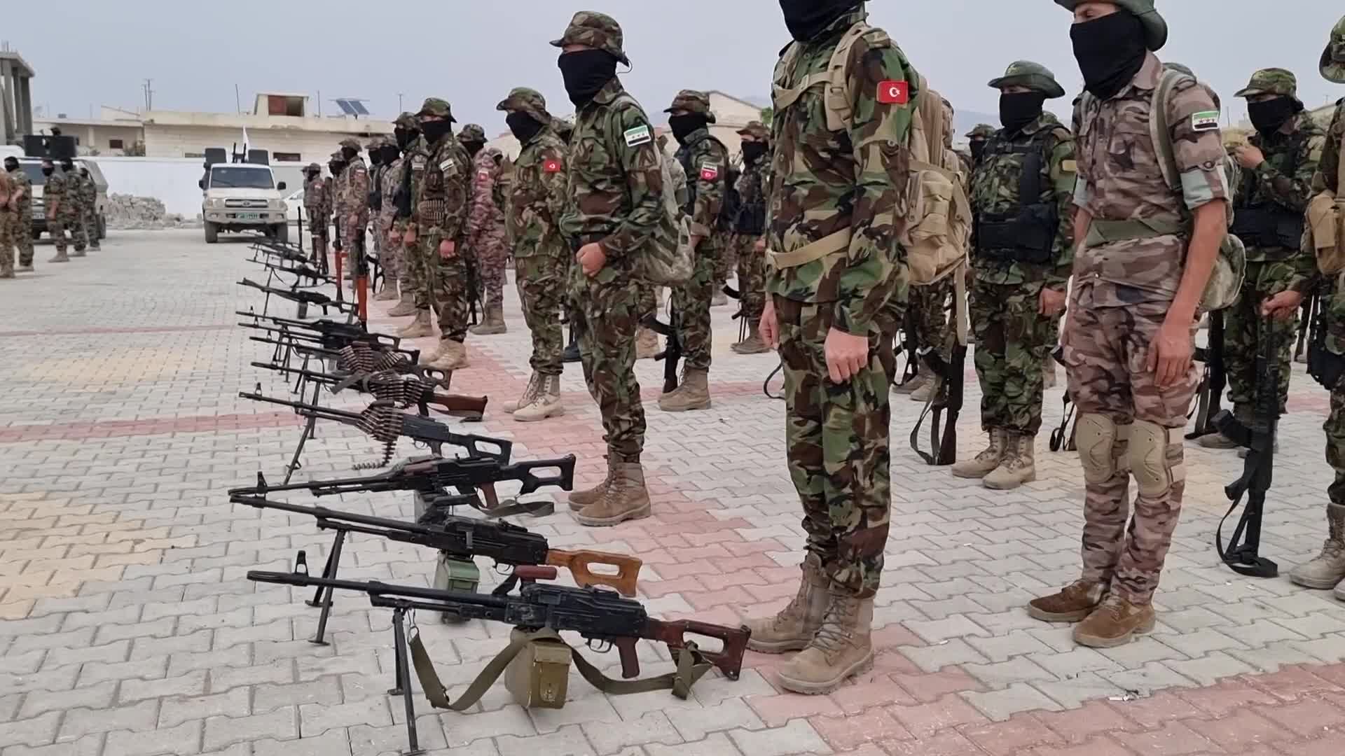 Turkish-backed Syrian rebel fighters take part in a military exercise