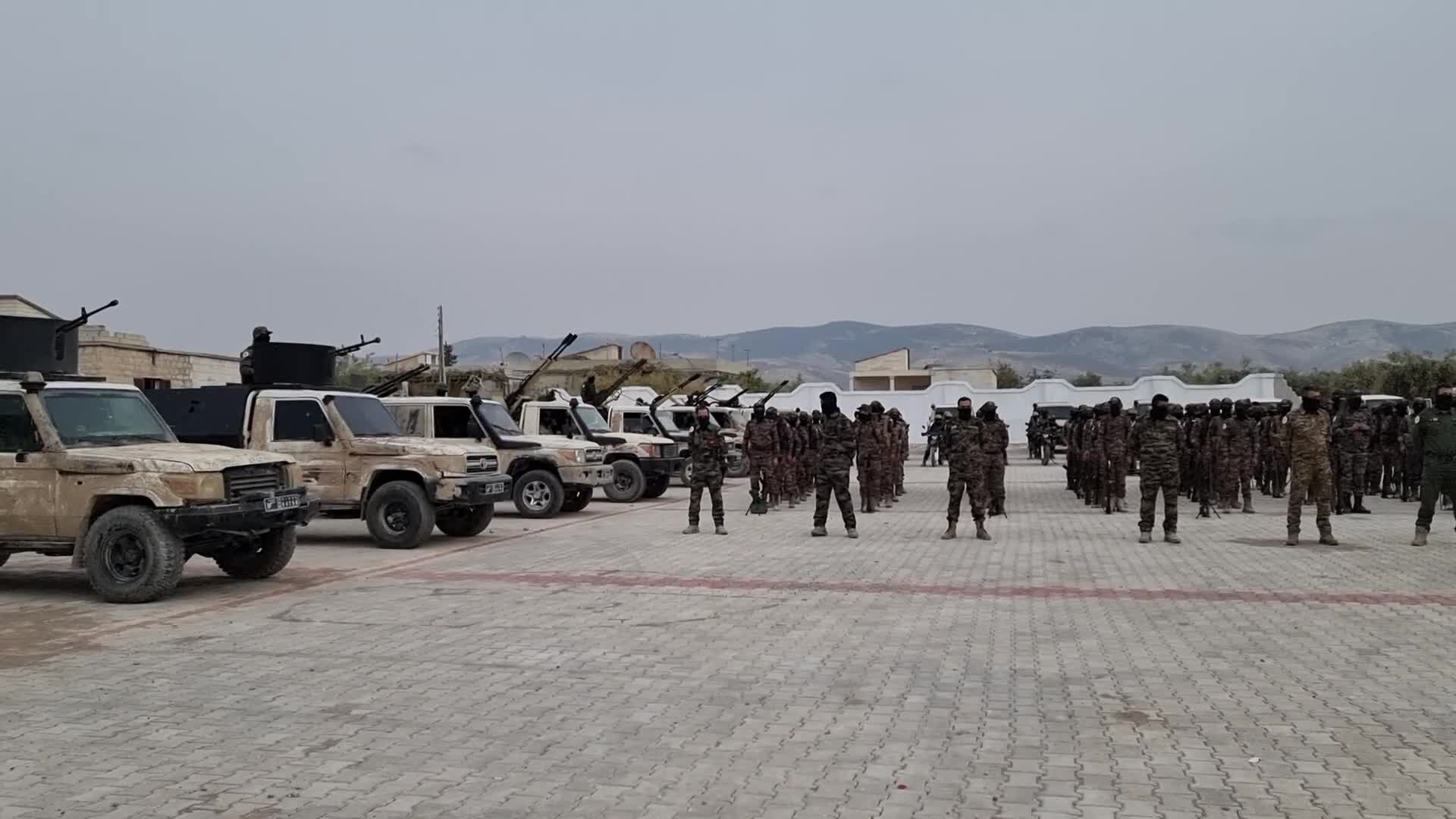 Turkish-backed Syrian rebel fighters take part in a military exercise