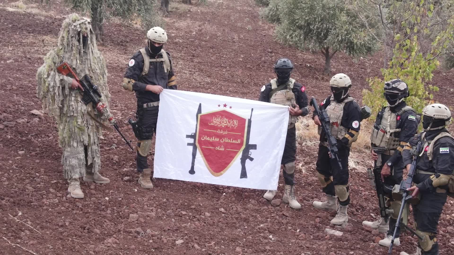 Turkish-backed Syrian rebel fighters take part in a military exercise