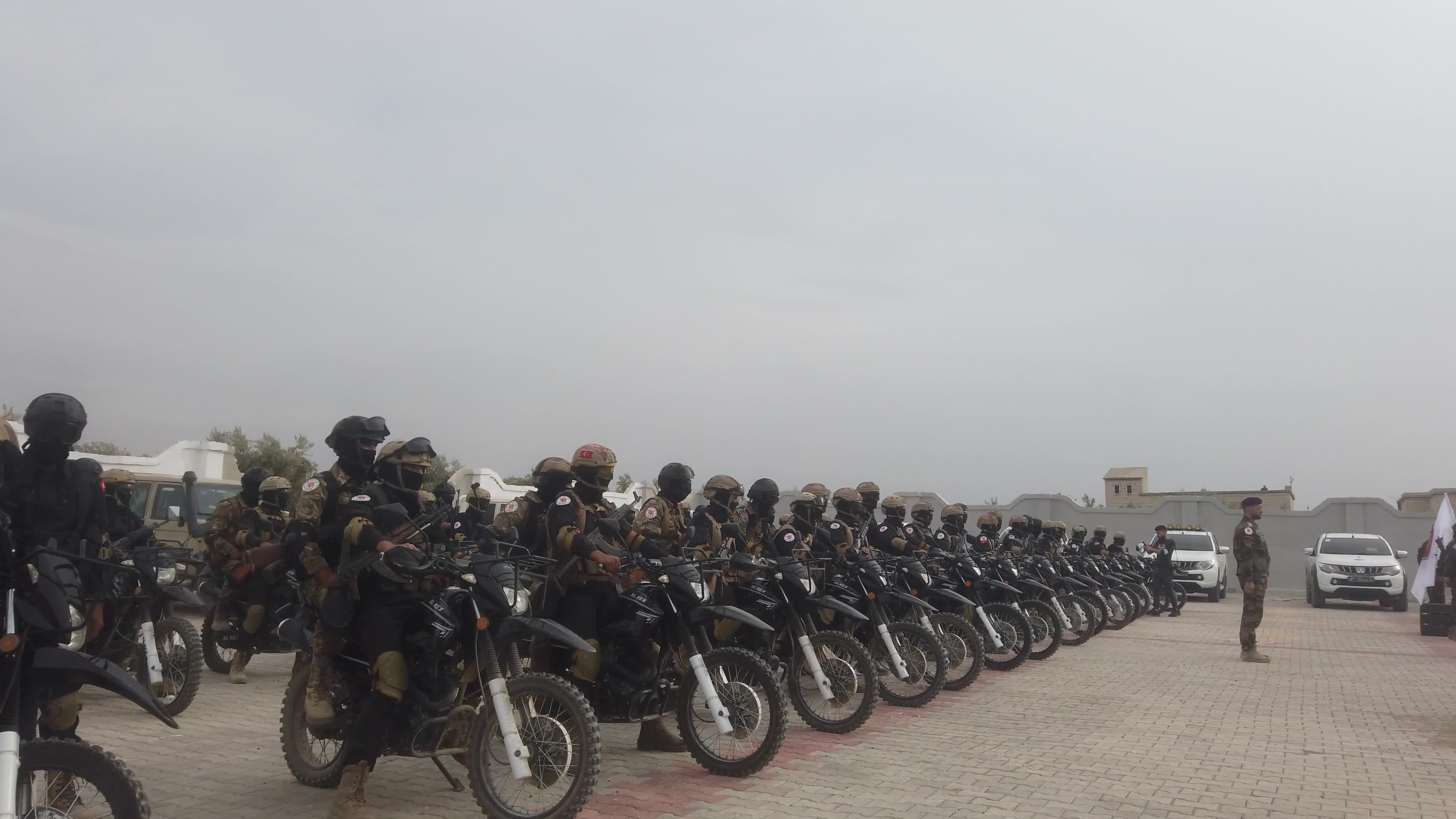 Turkish-backed Syrian rebel fighters take part in a military exercise