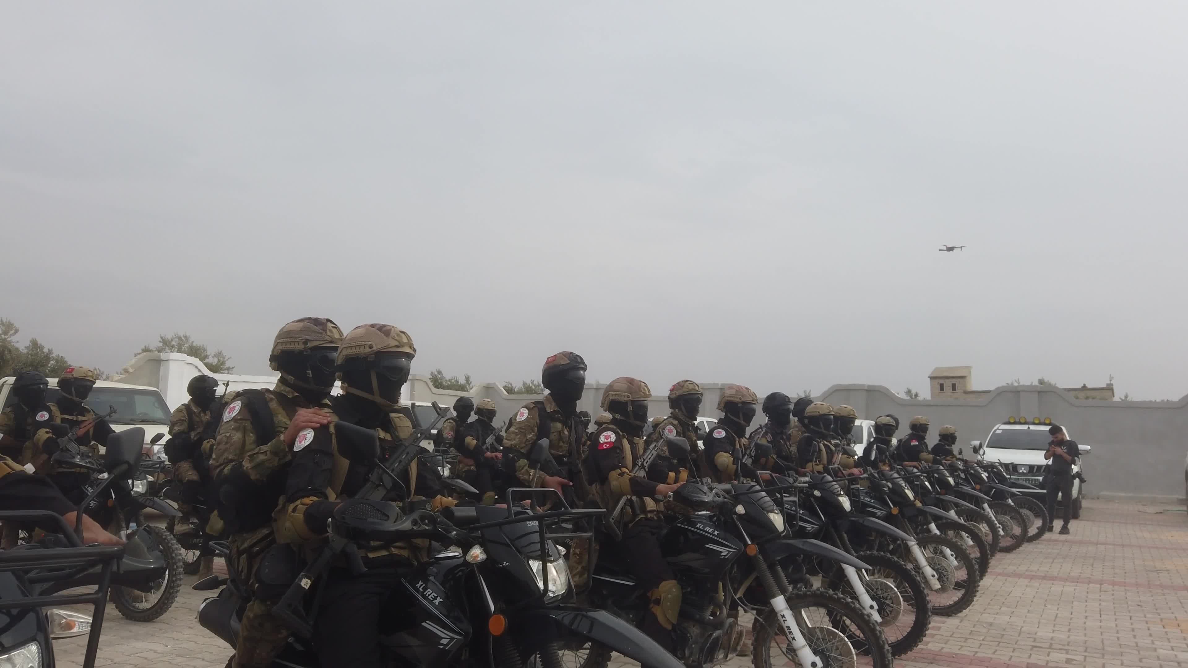 Turkish-backed Syrian rebel fighters take part in a military exercise