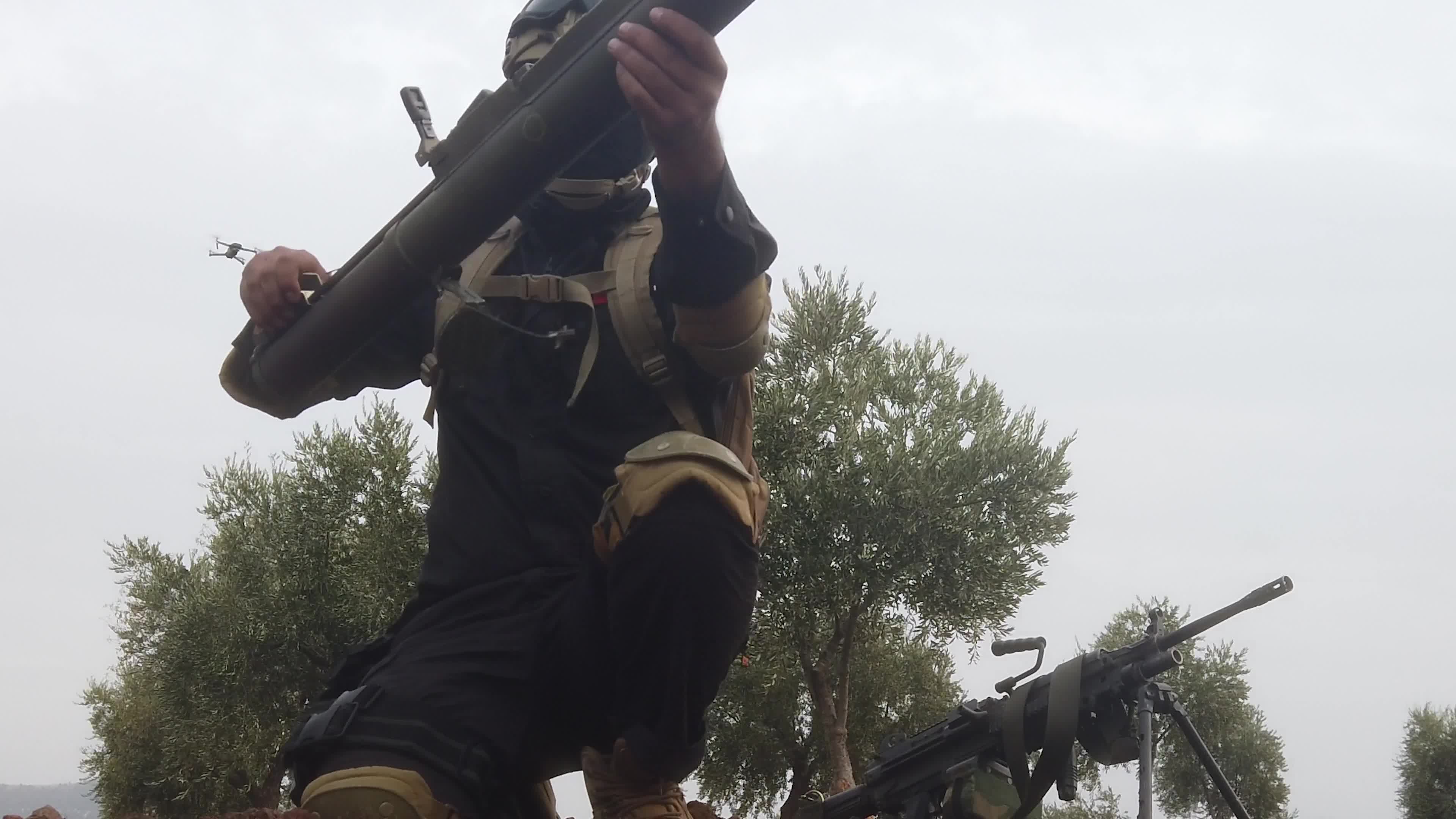 Turkish-backed Syrian rebel fighters take part in a military exercise