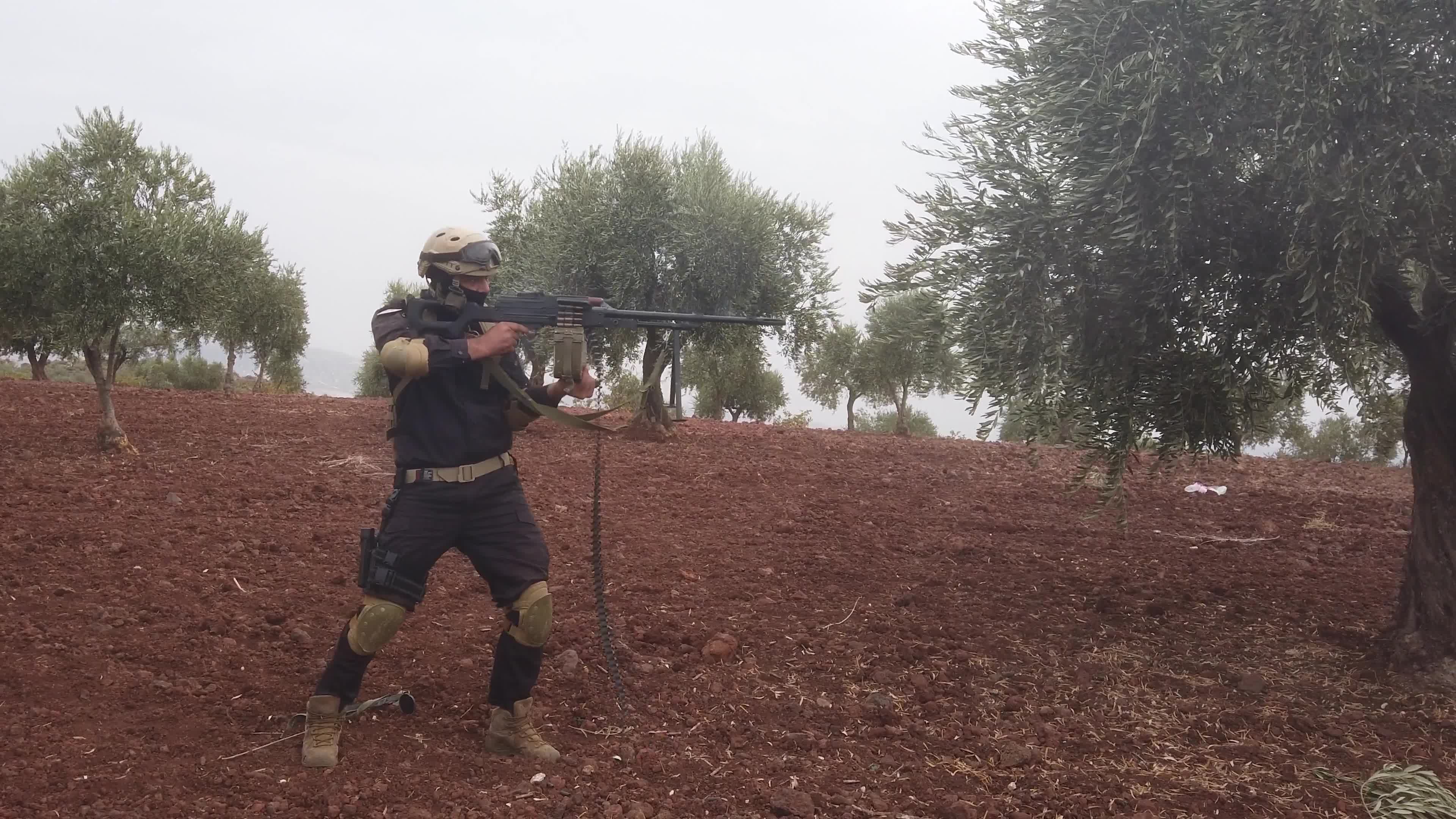 Turkish-backed Syrian rebel fighters take part in a military exercise