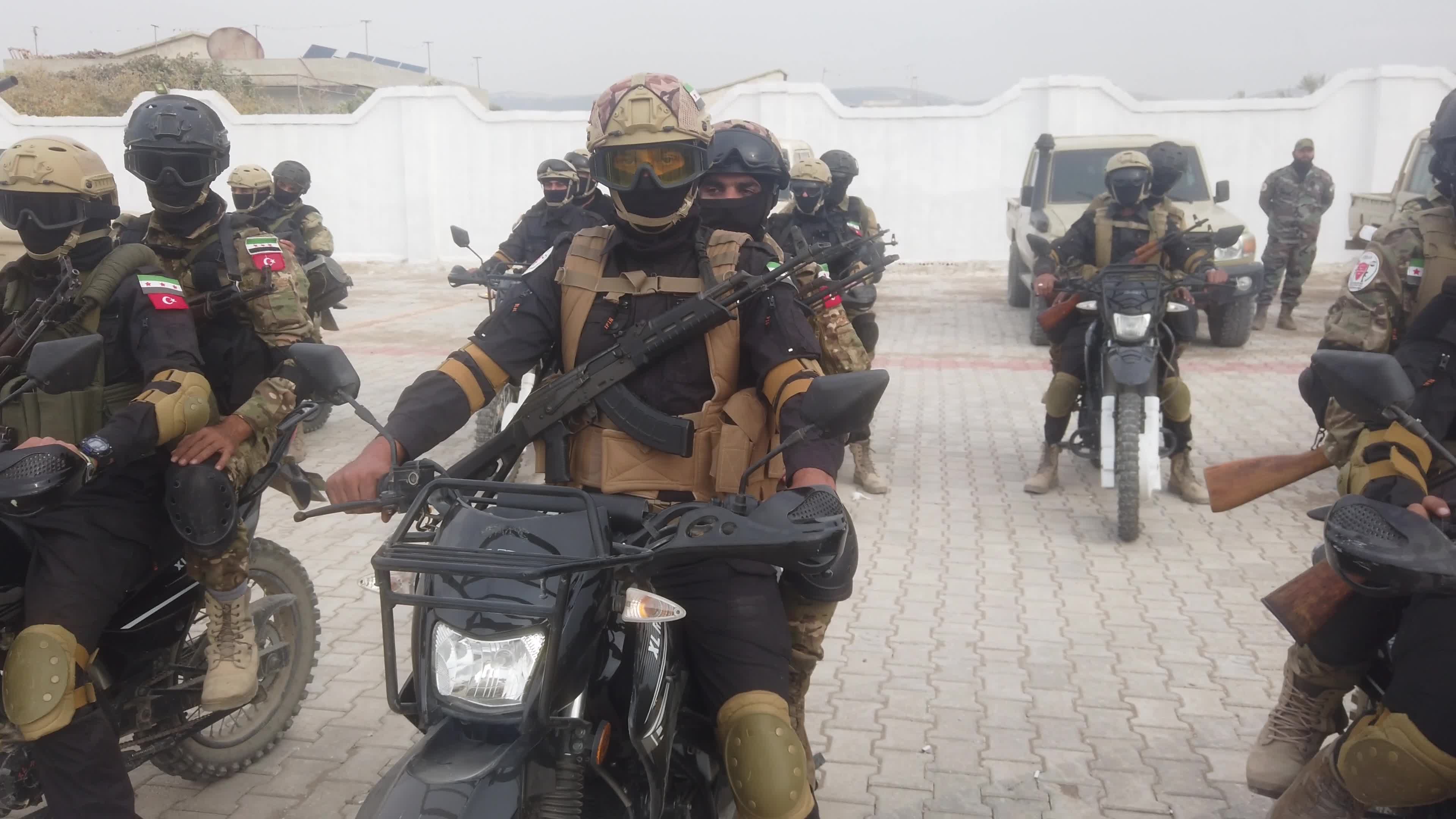 Turkish-backed Syrian rebel fighters take part in a military exercise