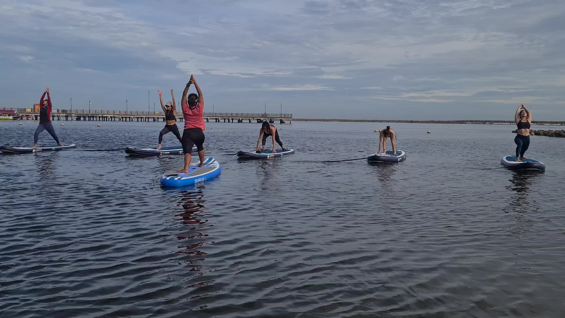 Paddle board yoga in Jakarta during the pandemic