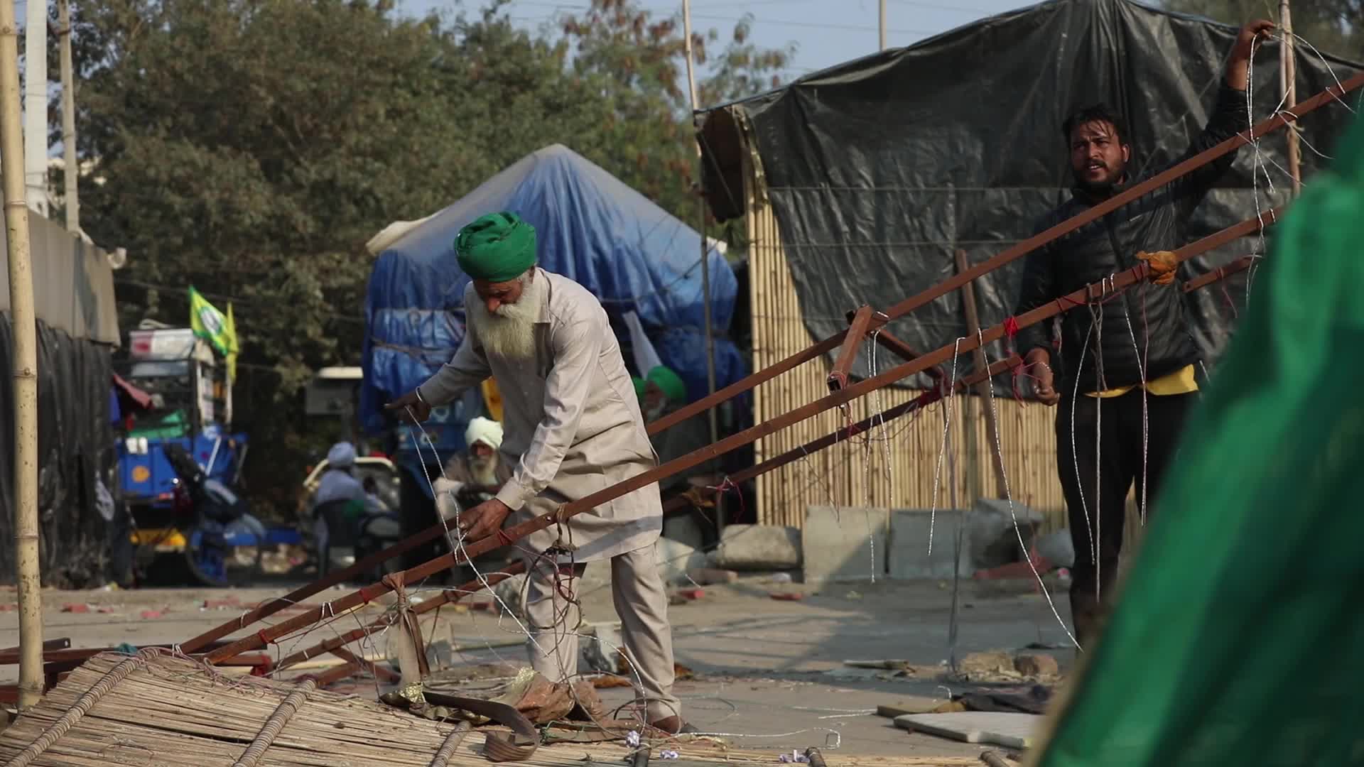 Indian farmers end year long protests and return home after government accepts demands