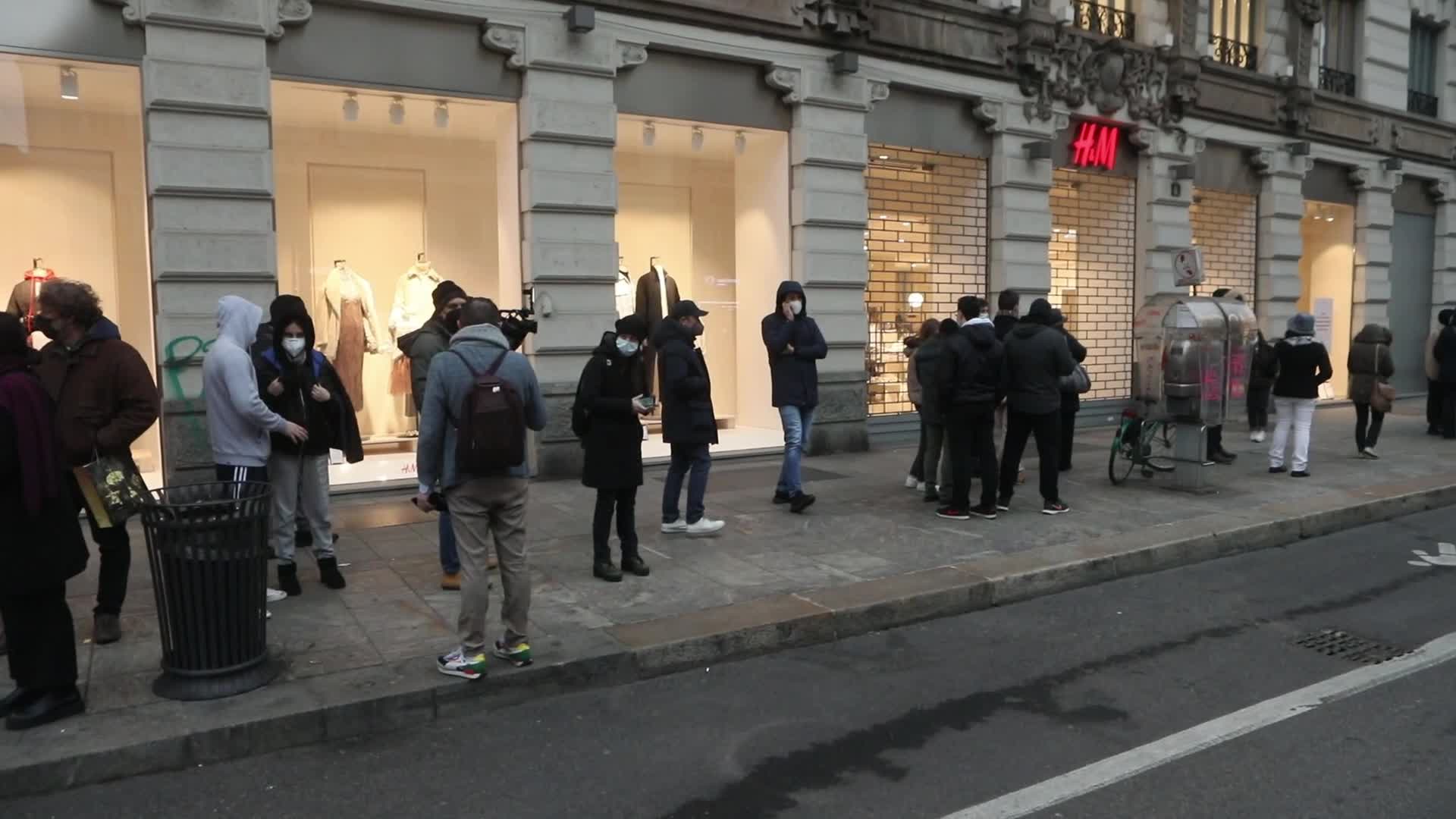 Queue at a pharmacy to purchase rapid test pads for covid-19