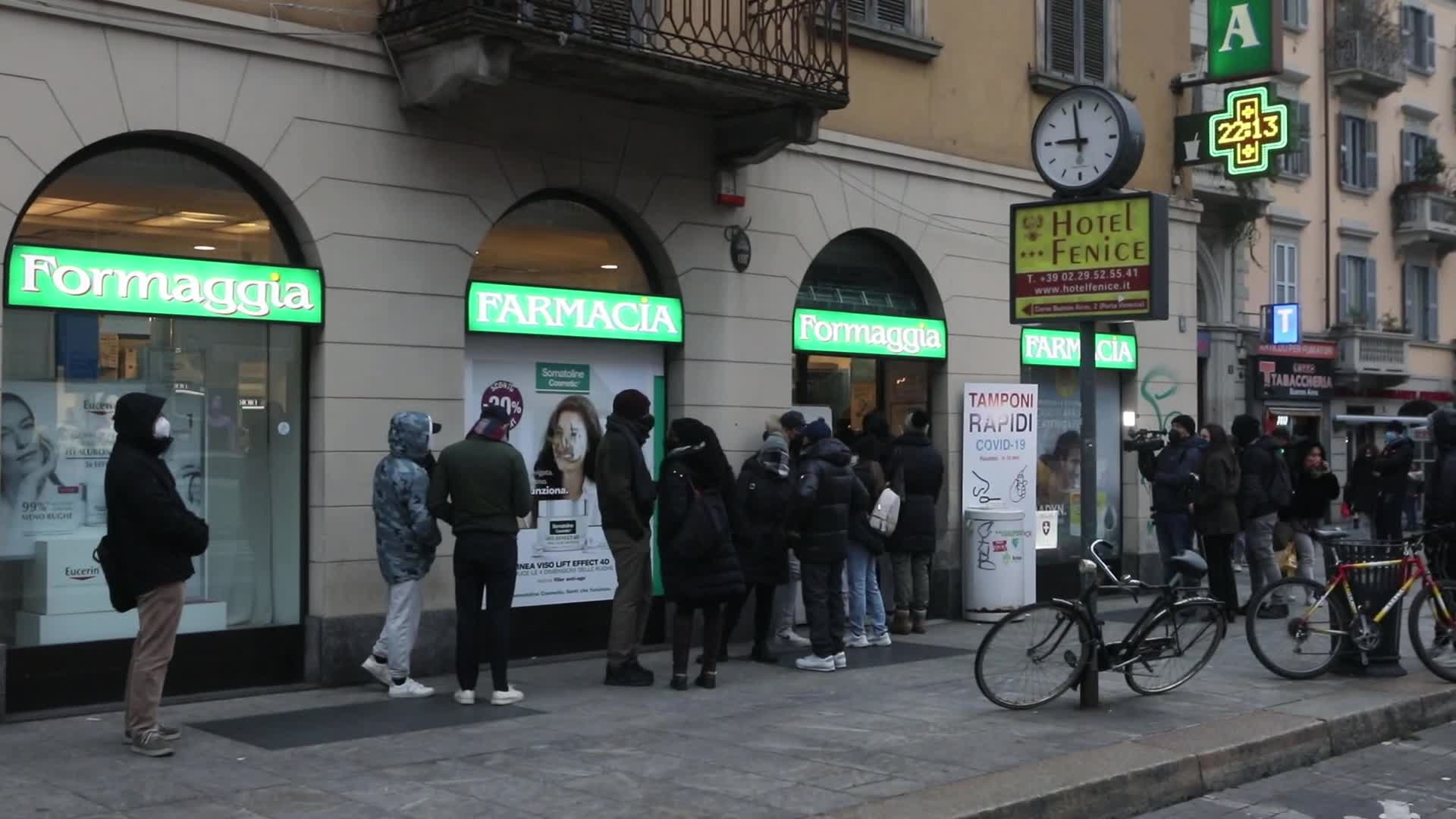 Queue at a pharmacy to purchase rapid test pads for covid-19