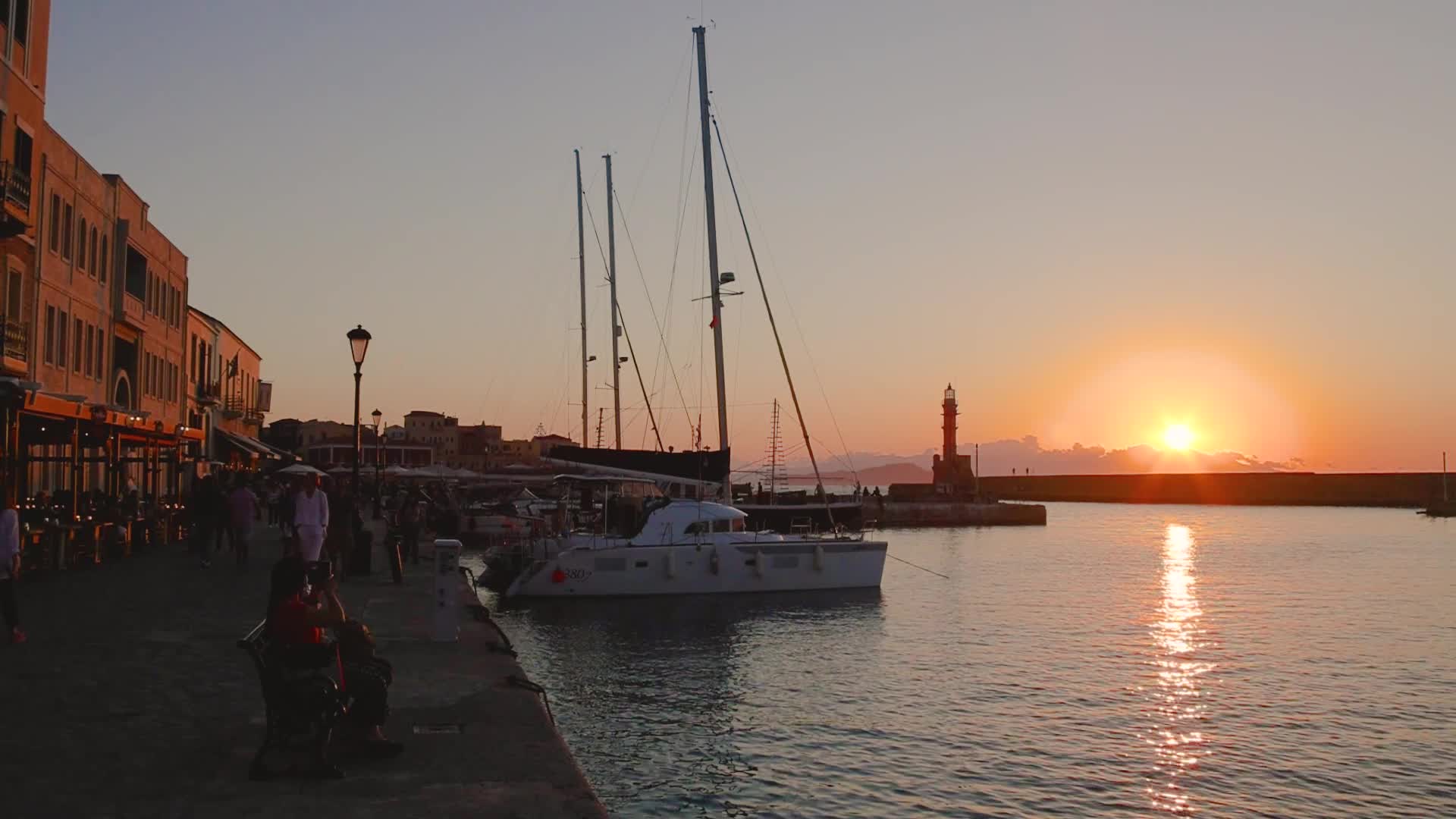 Magical sunset behind the lighthouse in Chania, Crete island, Greece