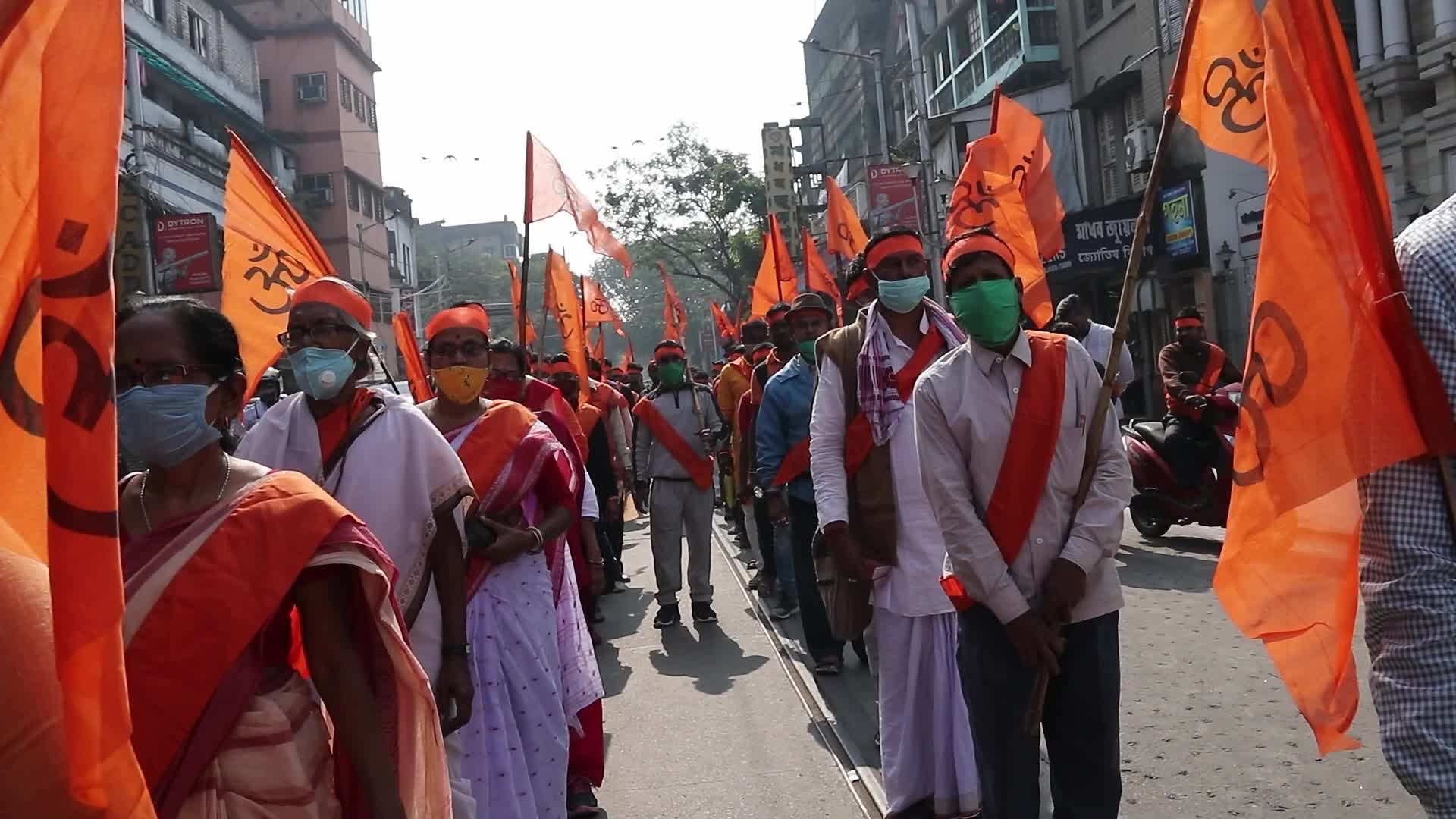 Vishwa Hindu Parishad and Bajrang Dal activists take part in a rally in Kolkata